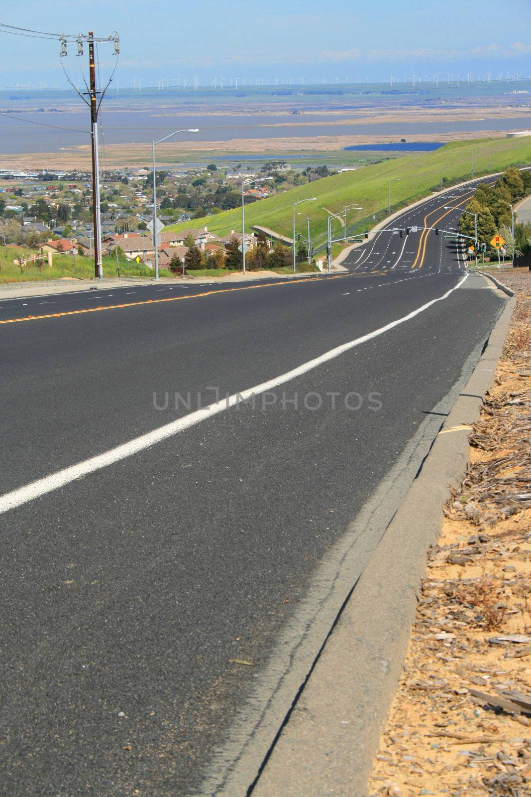 Long infinite road on a sunny day.
