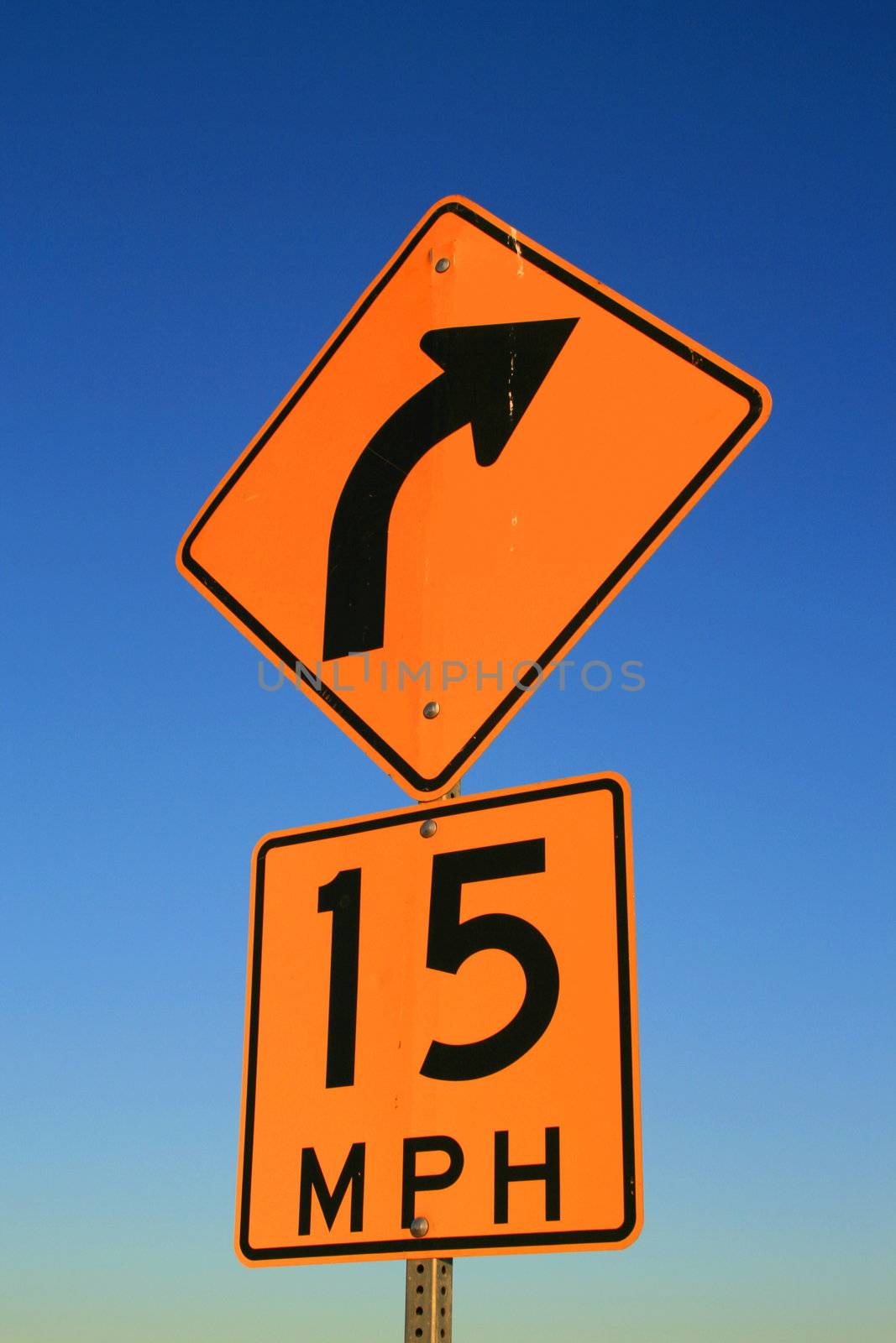 Speed limit road sign over blue sky.
