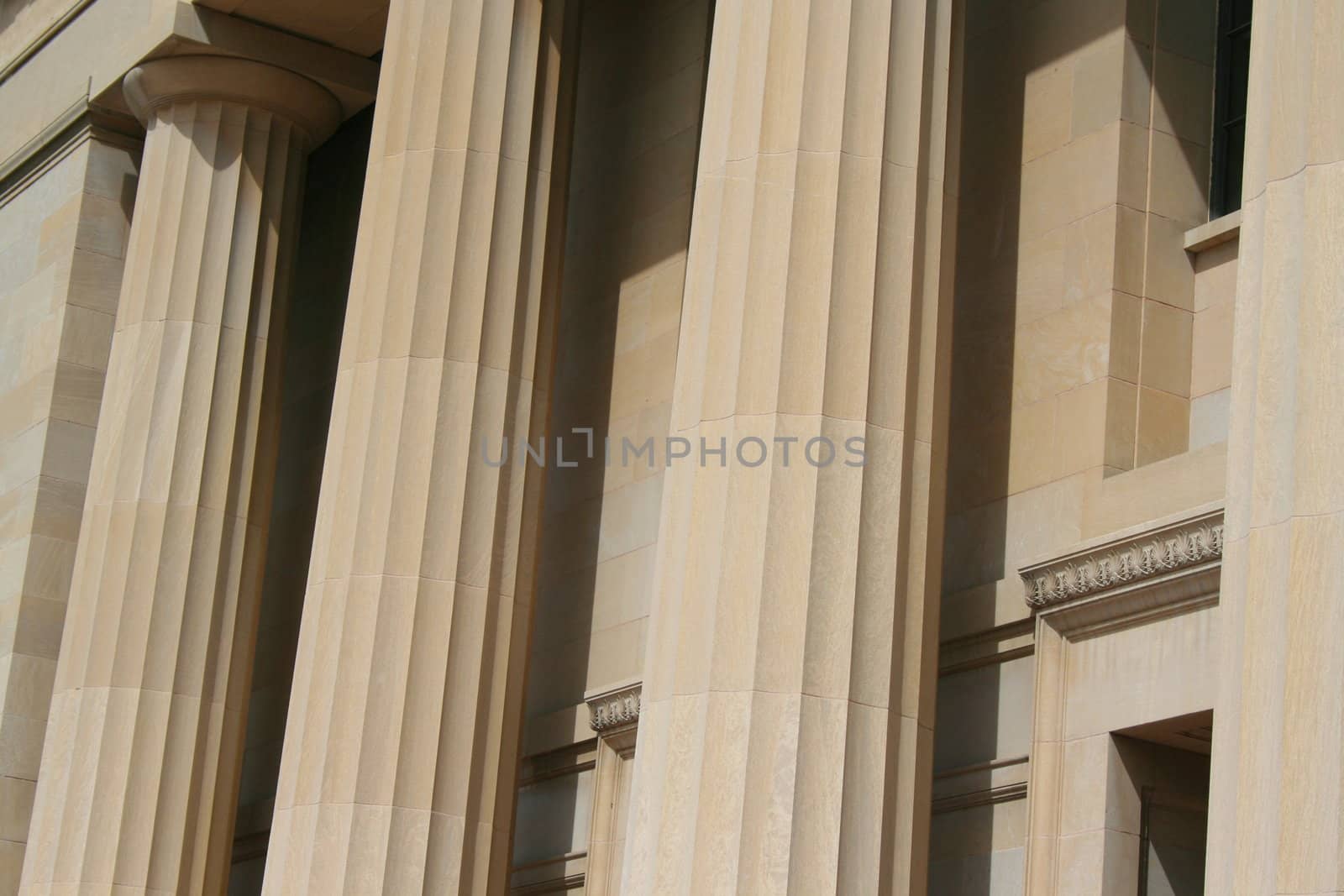 Row of columns showing unique architecture of a building.
