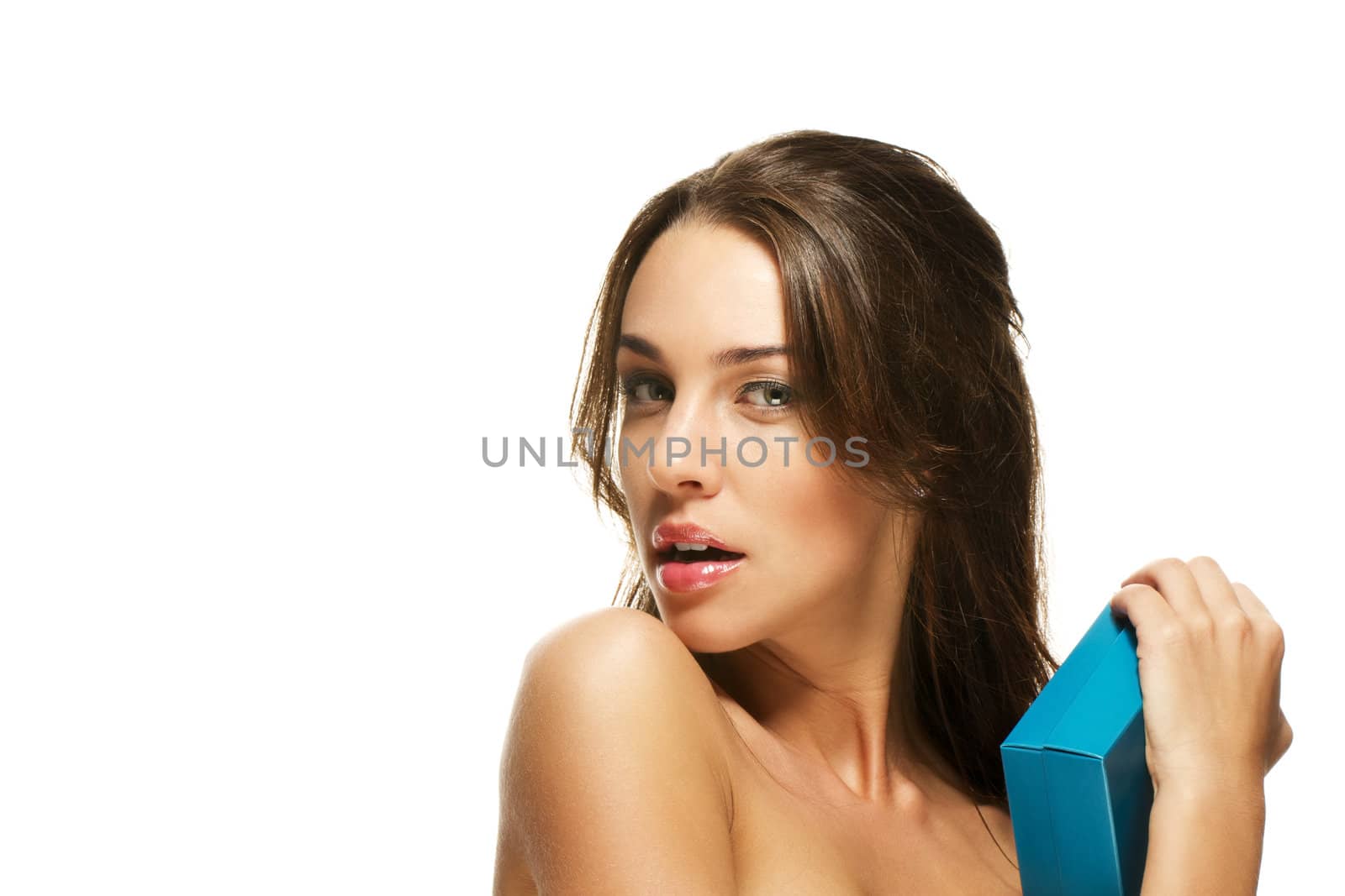 beautiful brunette woman hugs present on white background