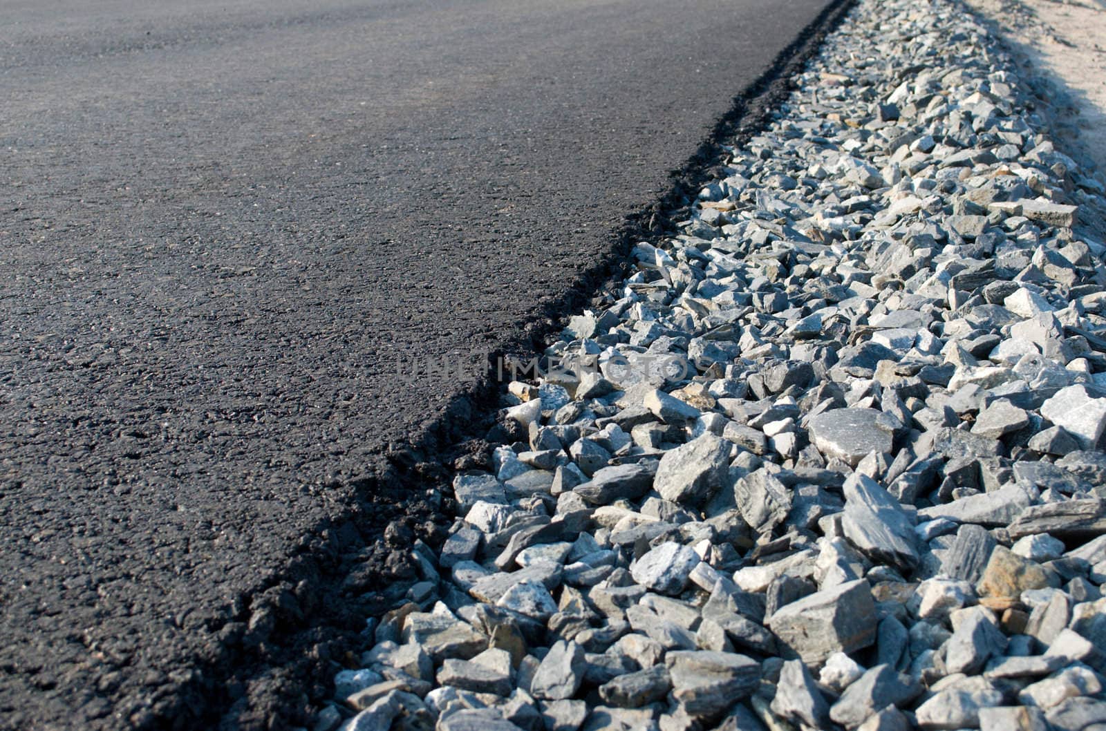 Freshly laid black tar asphalt pavement