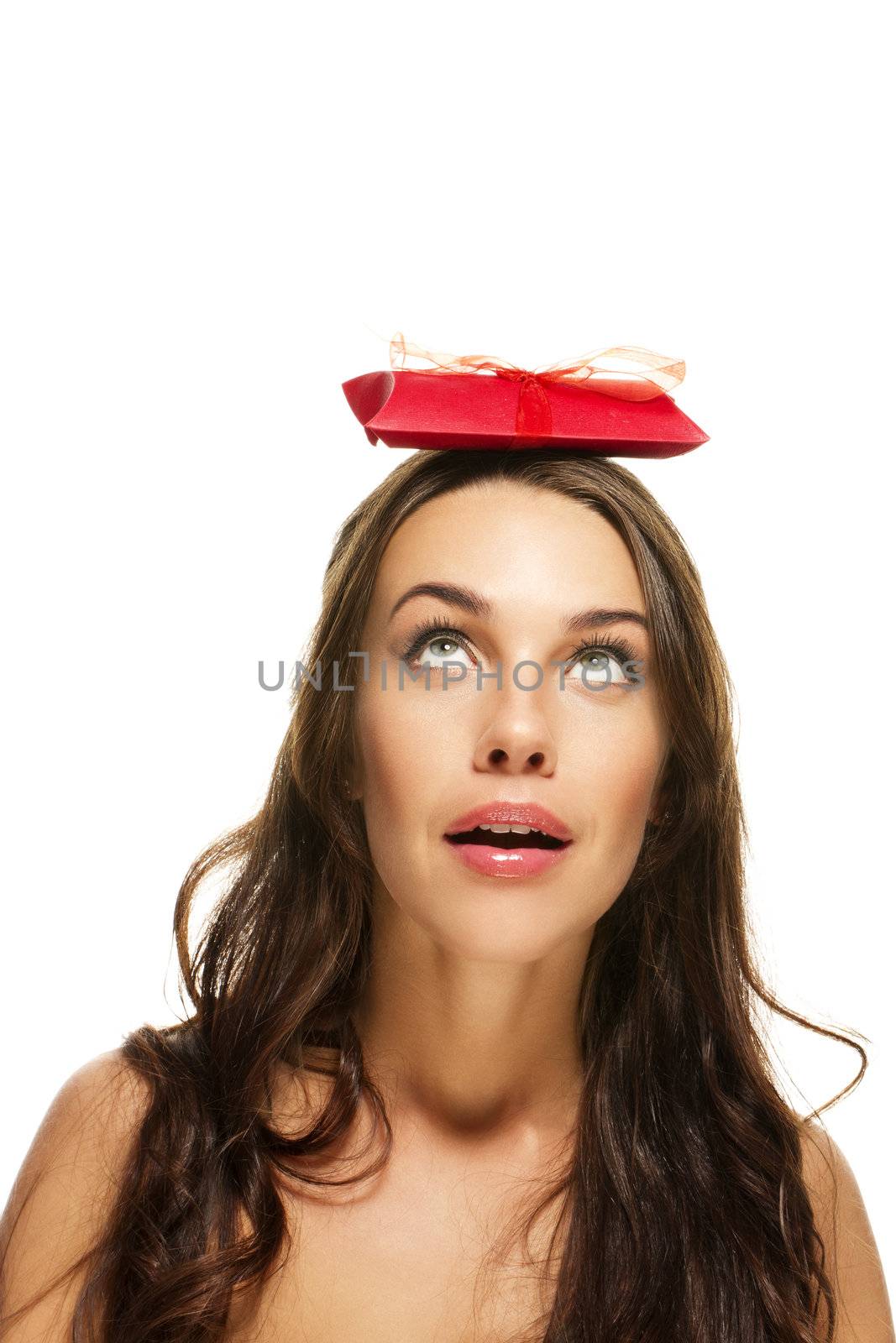 beautiful woman with a red present on her head on white background