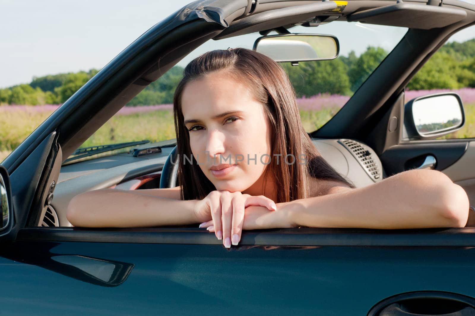 Outdoor shot of beautiful brunette woman with long hair