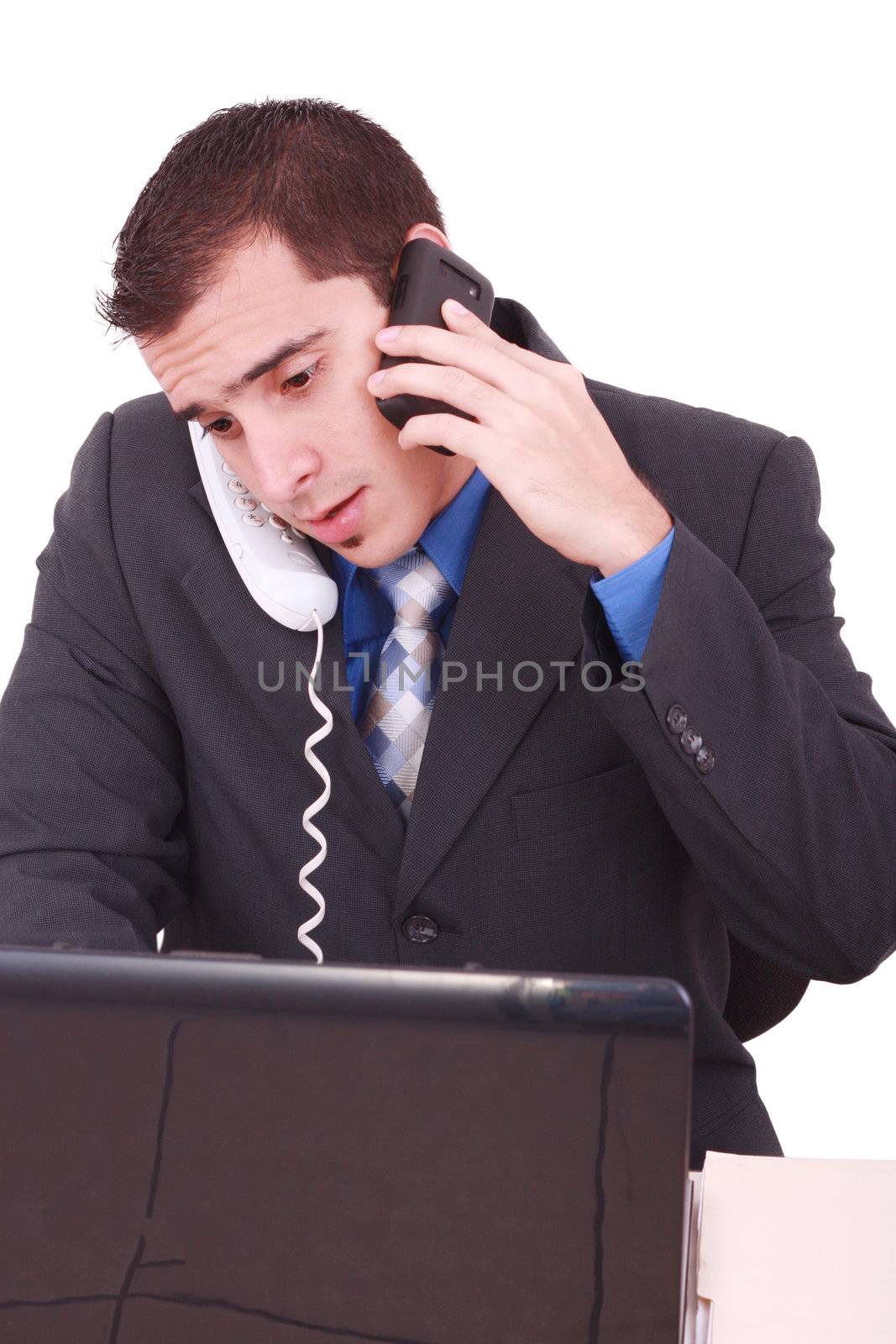 Isolated Stressed Businessman At His Desk Working - White Background by dacasdo