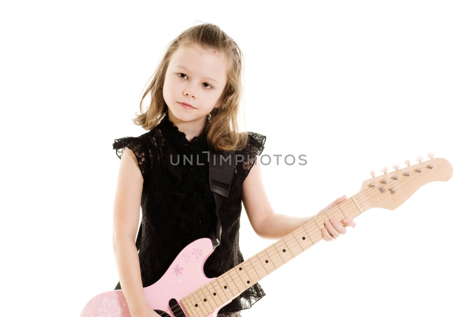 Portrait of pre-teen girl playing a guitar isolated on white