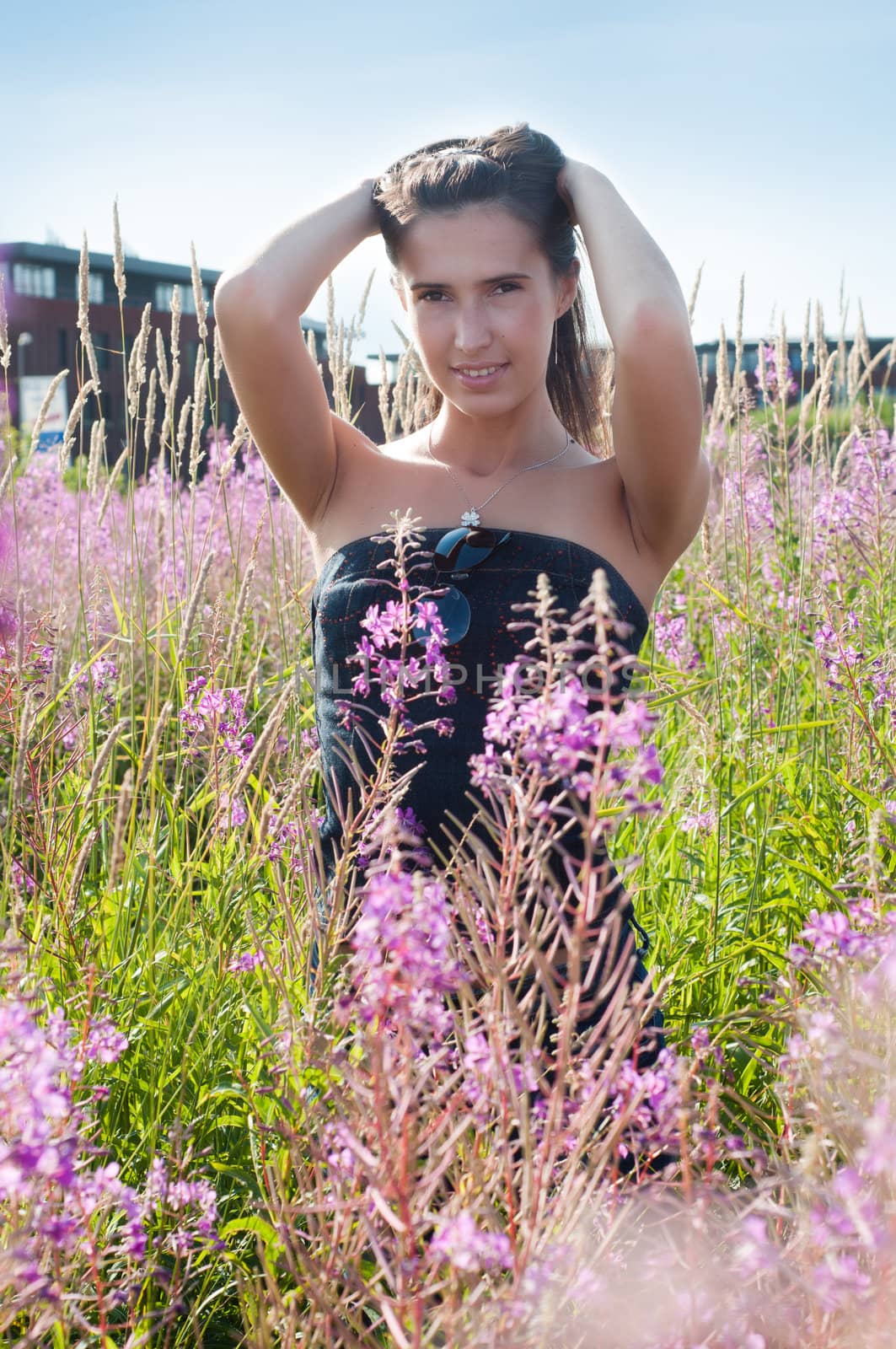 Outdoor shot of beautiful brunette woman with long hair