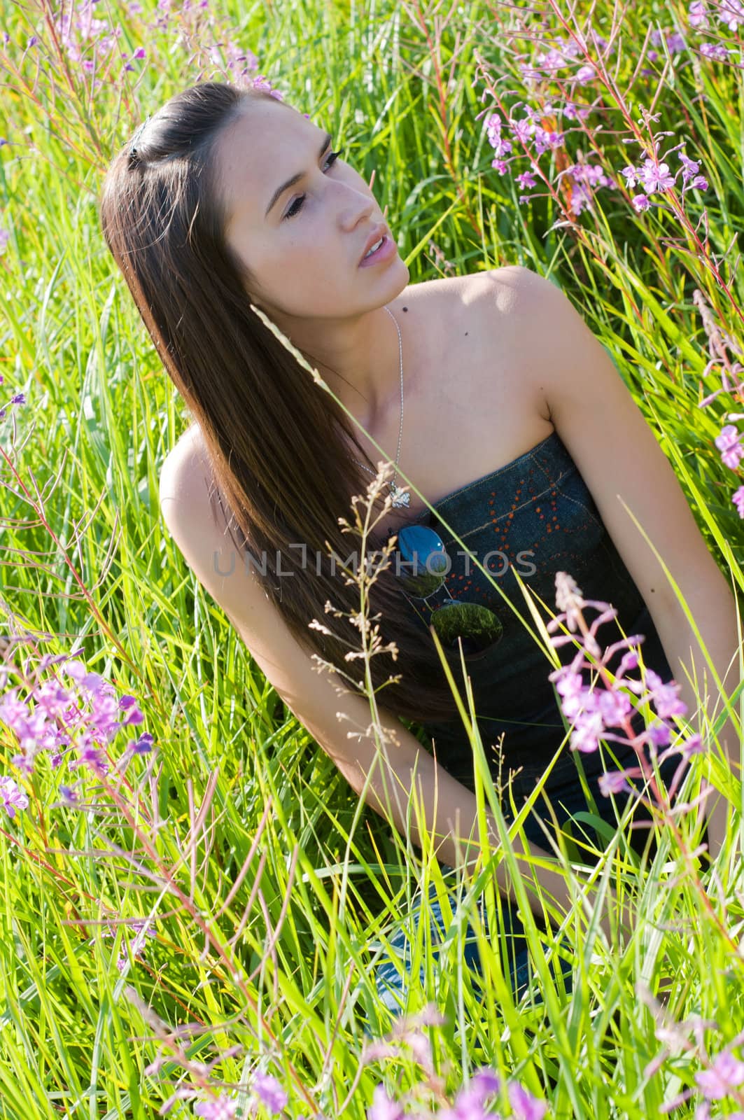 Outdoor shot of beautiful brunette woman with long hair