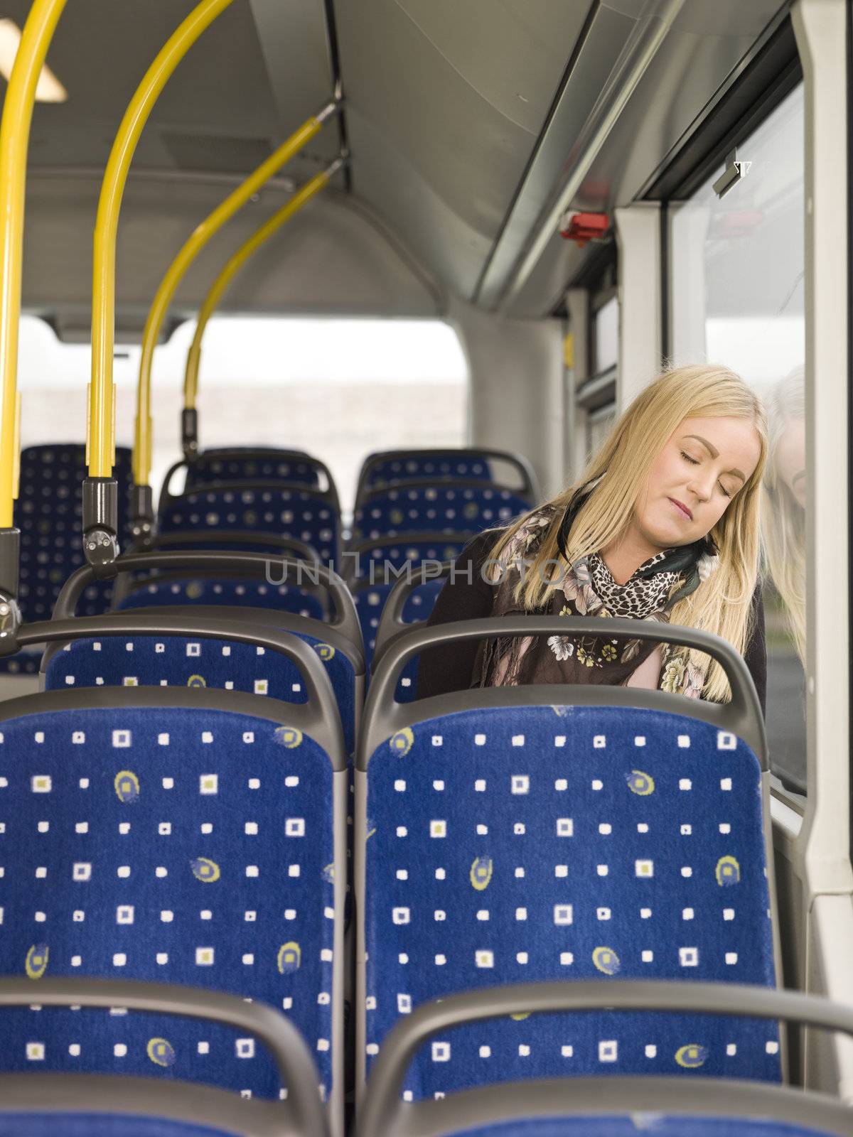 Young woman sleeping on the bus