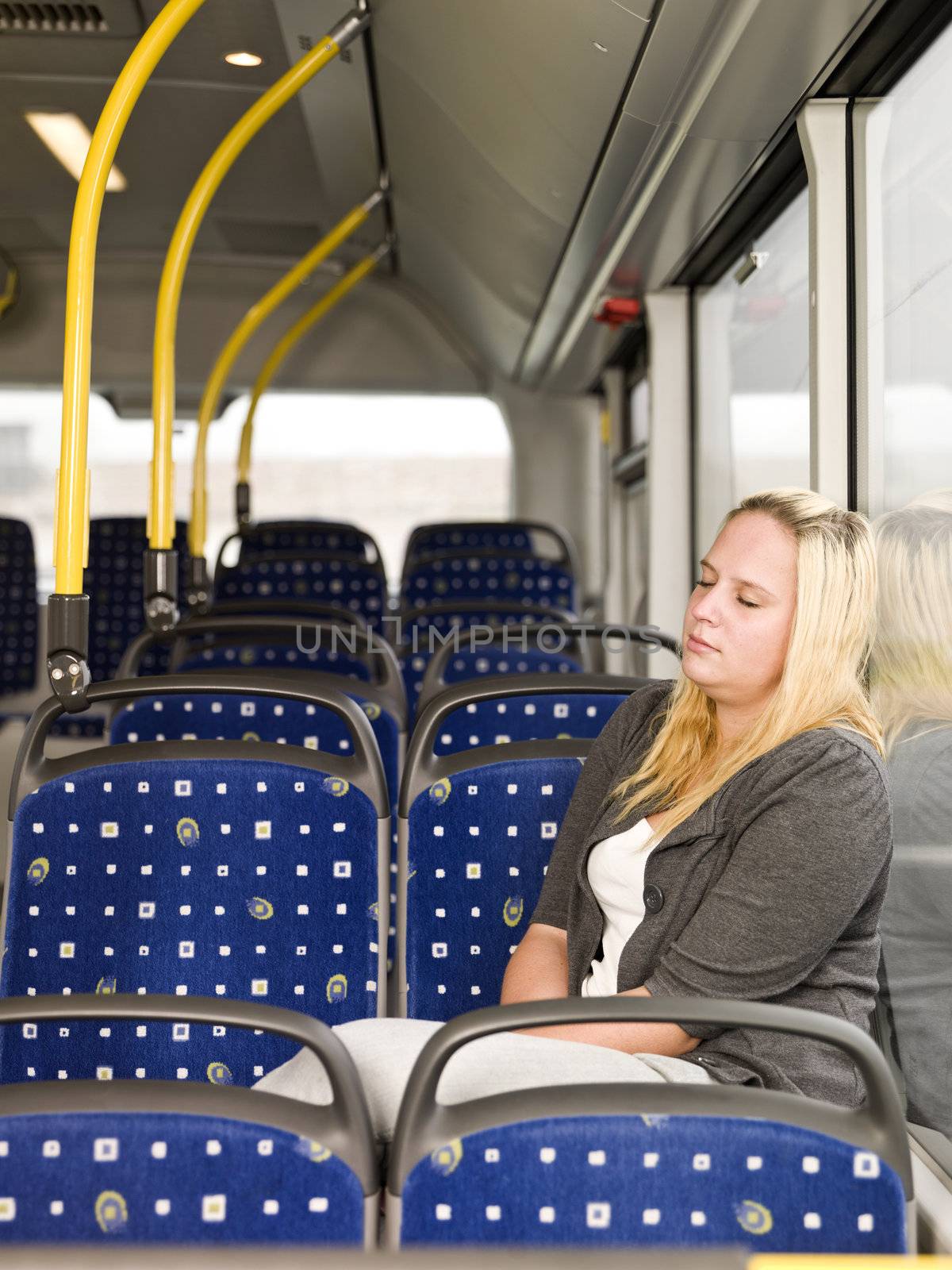 Young woman sleeping on the bus