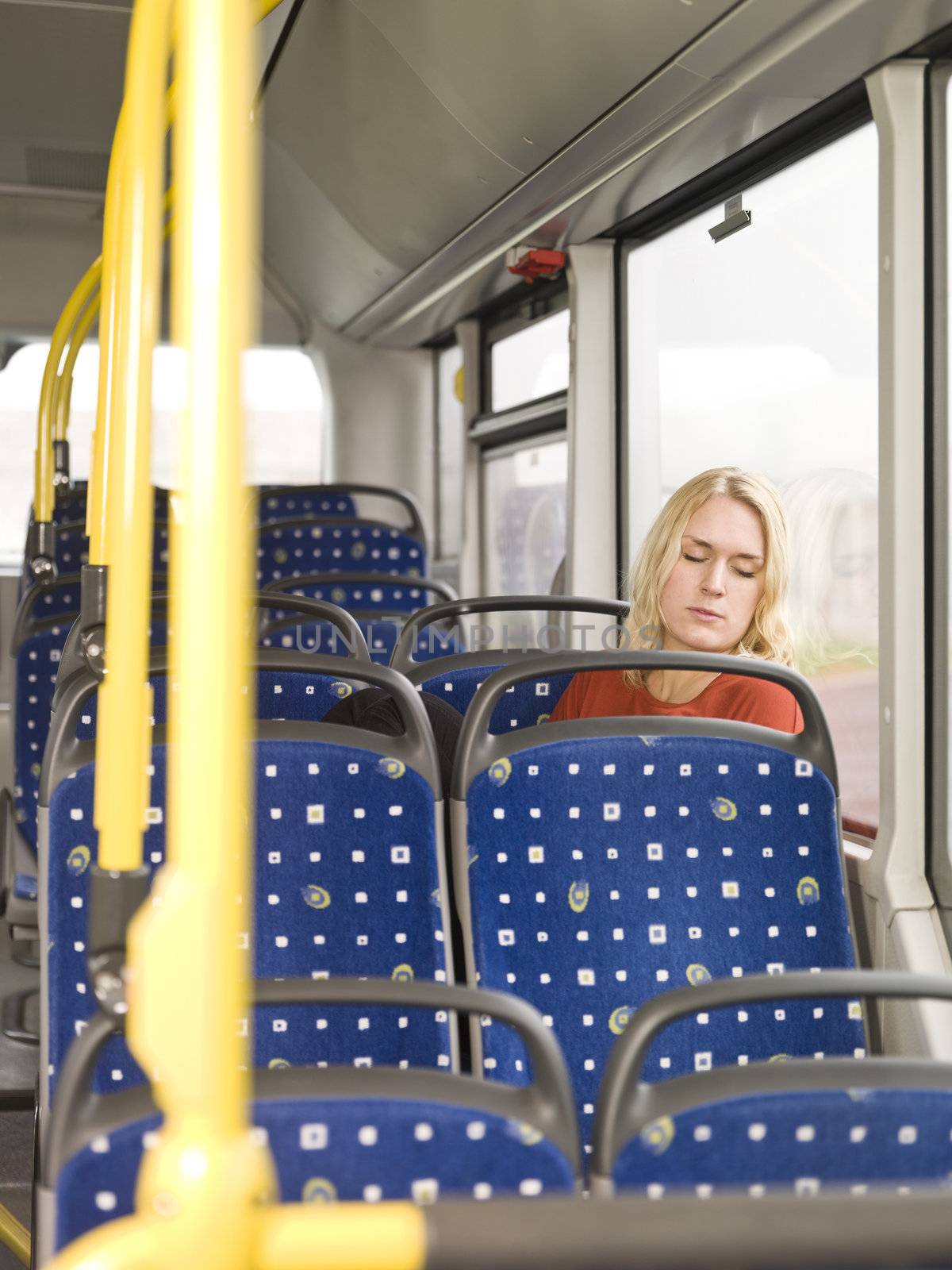 Young woman sleeping on the bus