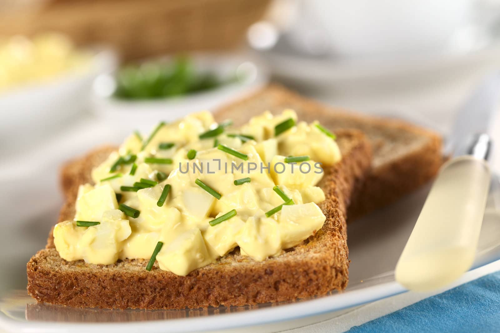 Egg salad with chives on wholewheat toast bread (Selective Focus, Focus one third into the salad)