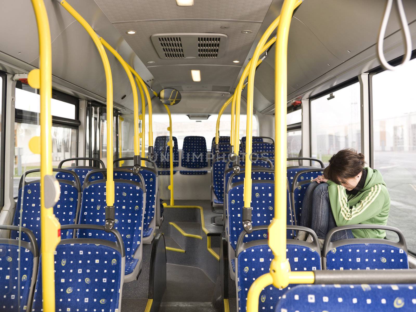 Sad woman alone on the bus