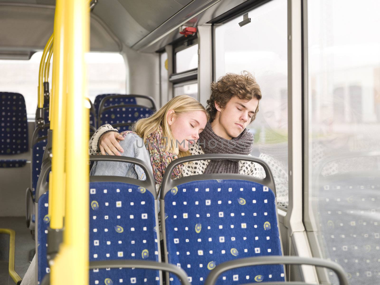 Young couple sleeps on the bus