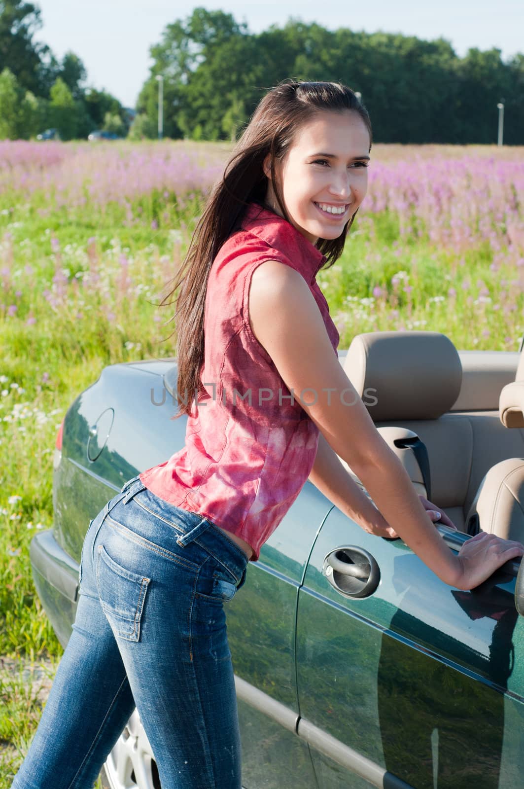 Outdoor shot of beautiful brunette woman with long hair