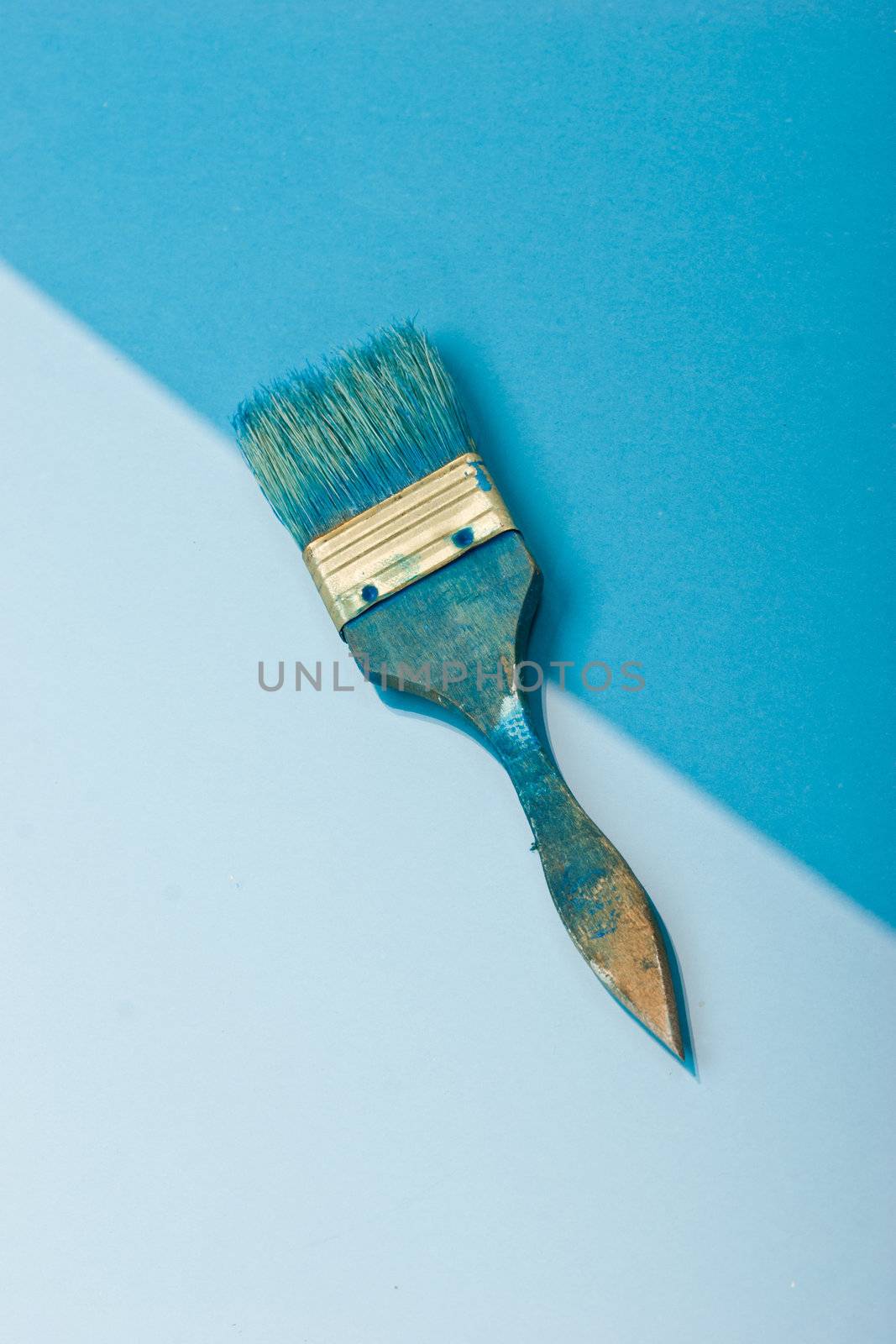 blue paint brush on the blue background