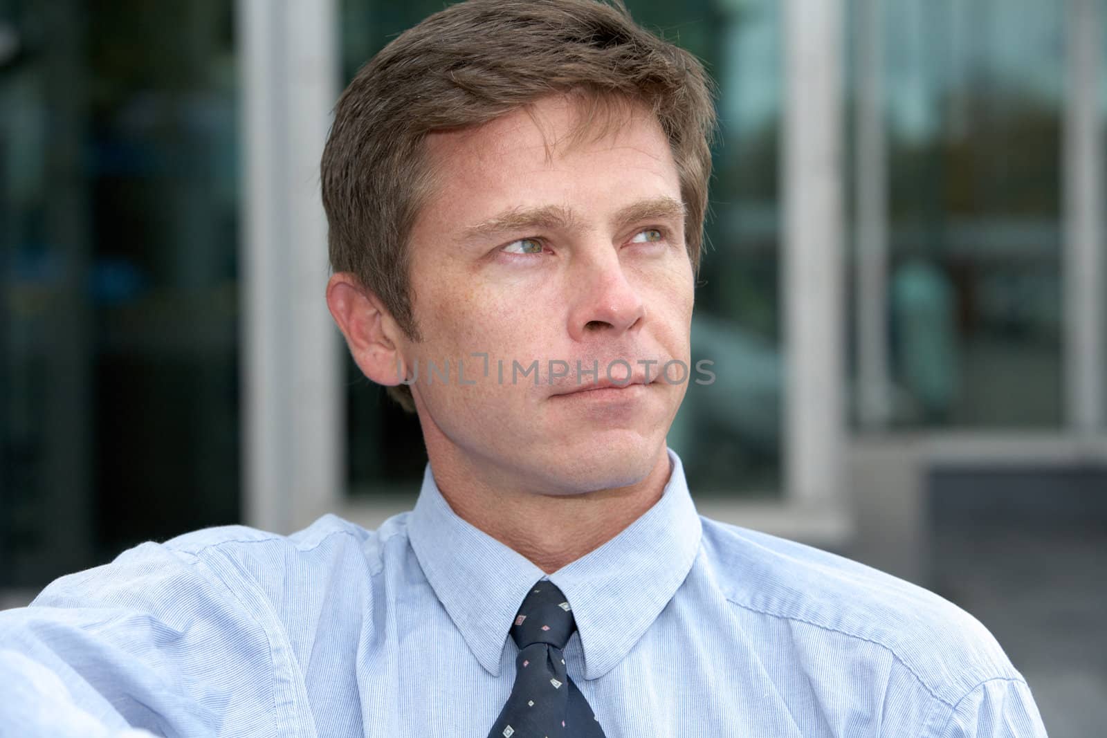 Man contemplating outdoors in city