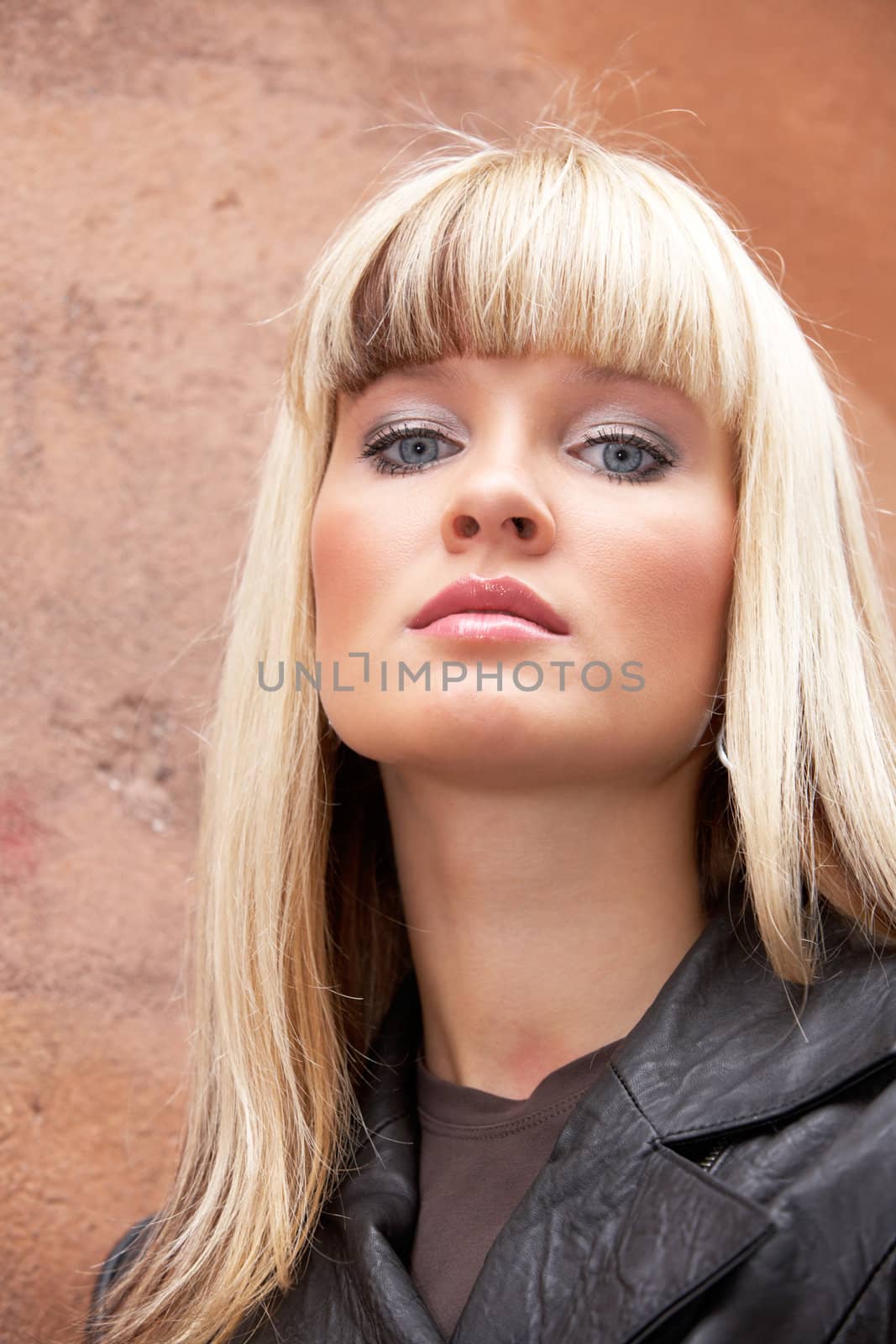Portrait of young woman looking at camera, low angle view