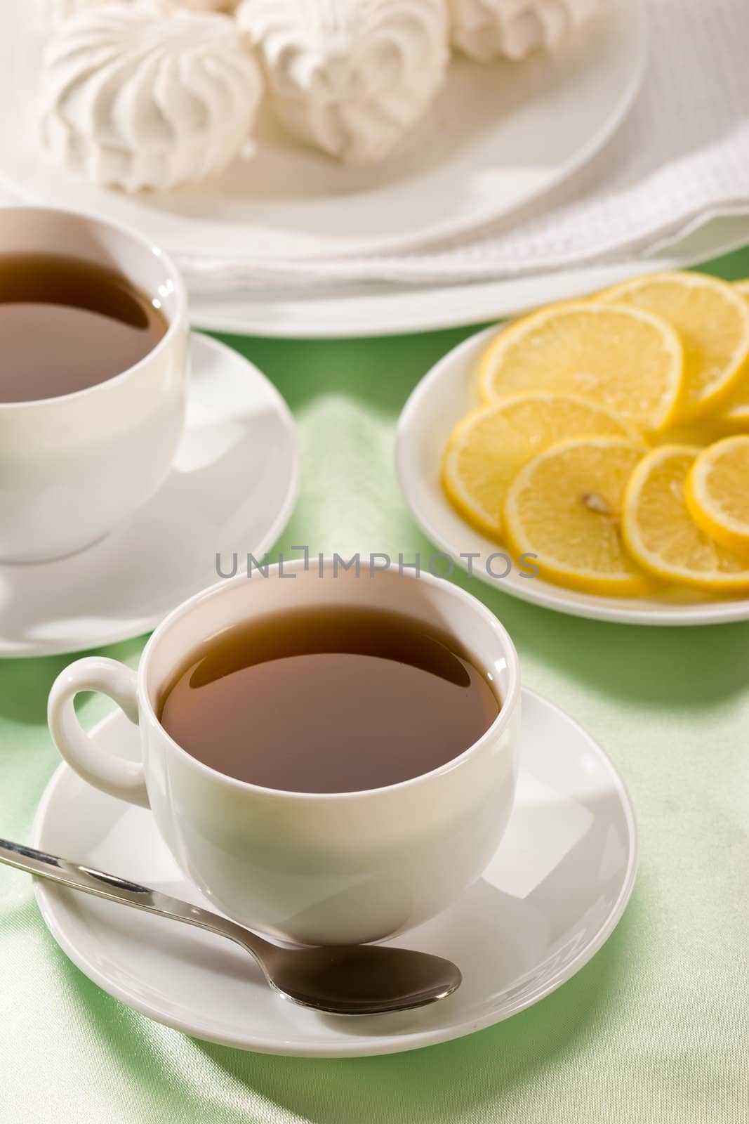 white cup of tea with lemon, hot drink