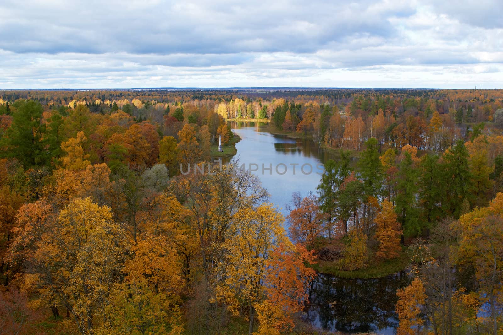 Areal view of lake and golden autumn trees  in Gatchina park. St. Petersburg