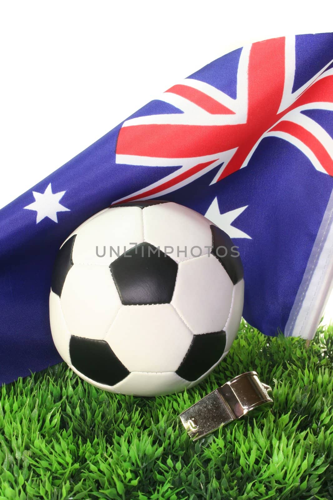 Flag of Australia with soccer in a field