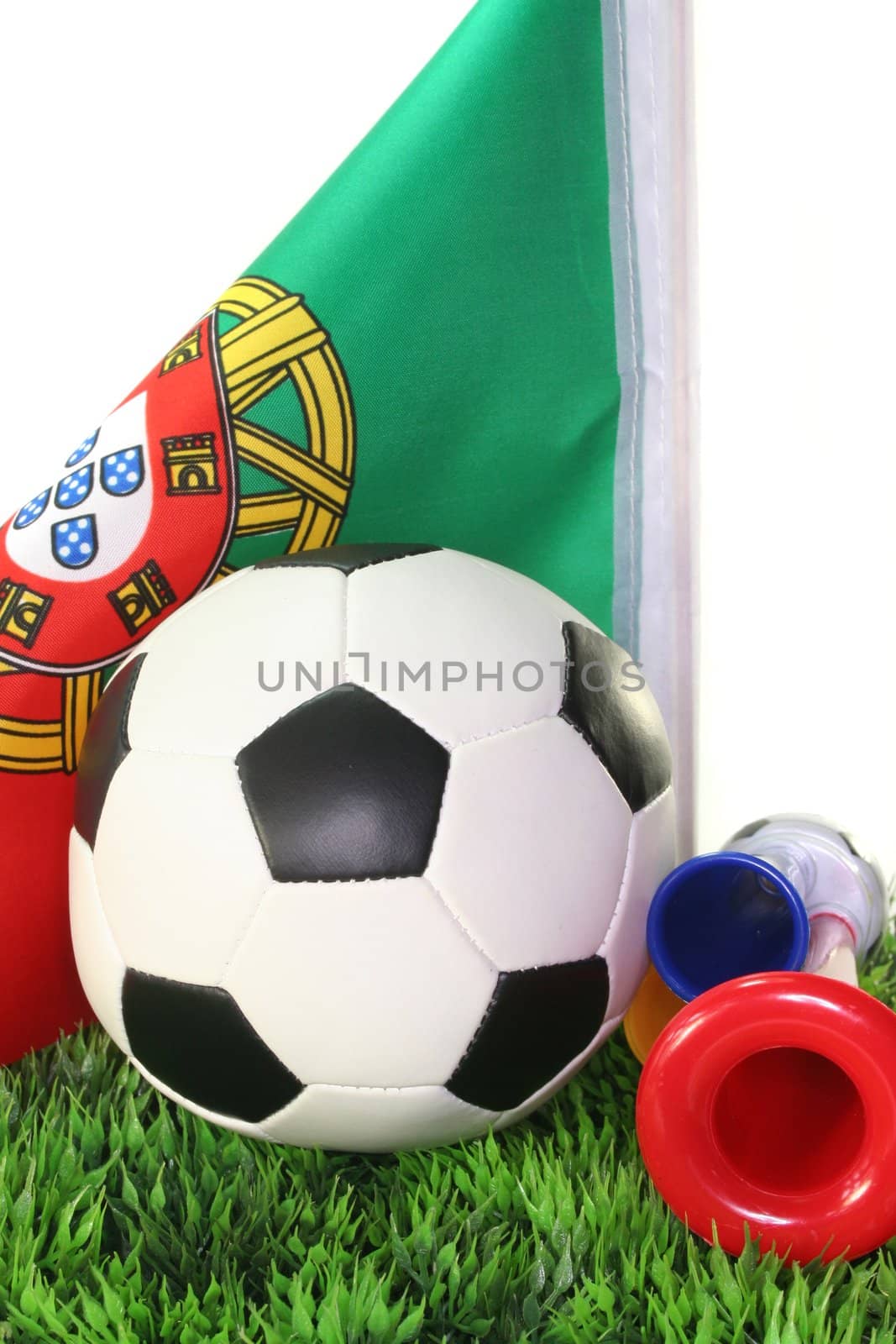 Flag of Portugal with a football in a field