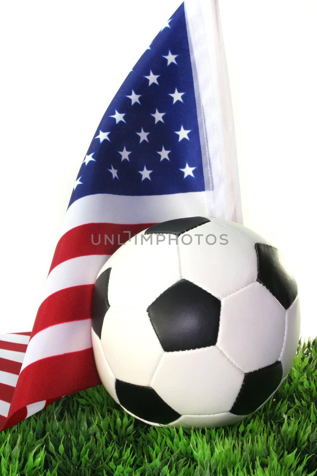 Flag of the United States with football in a field