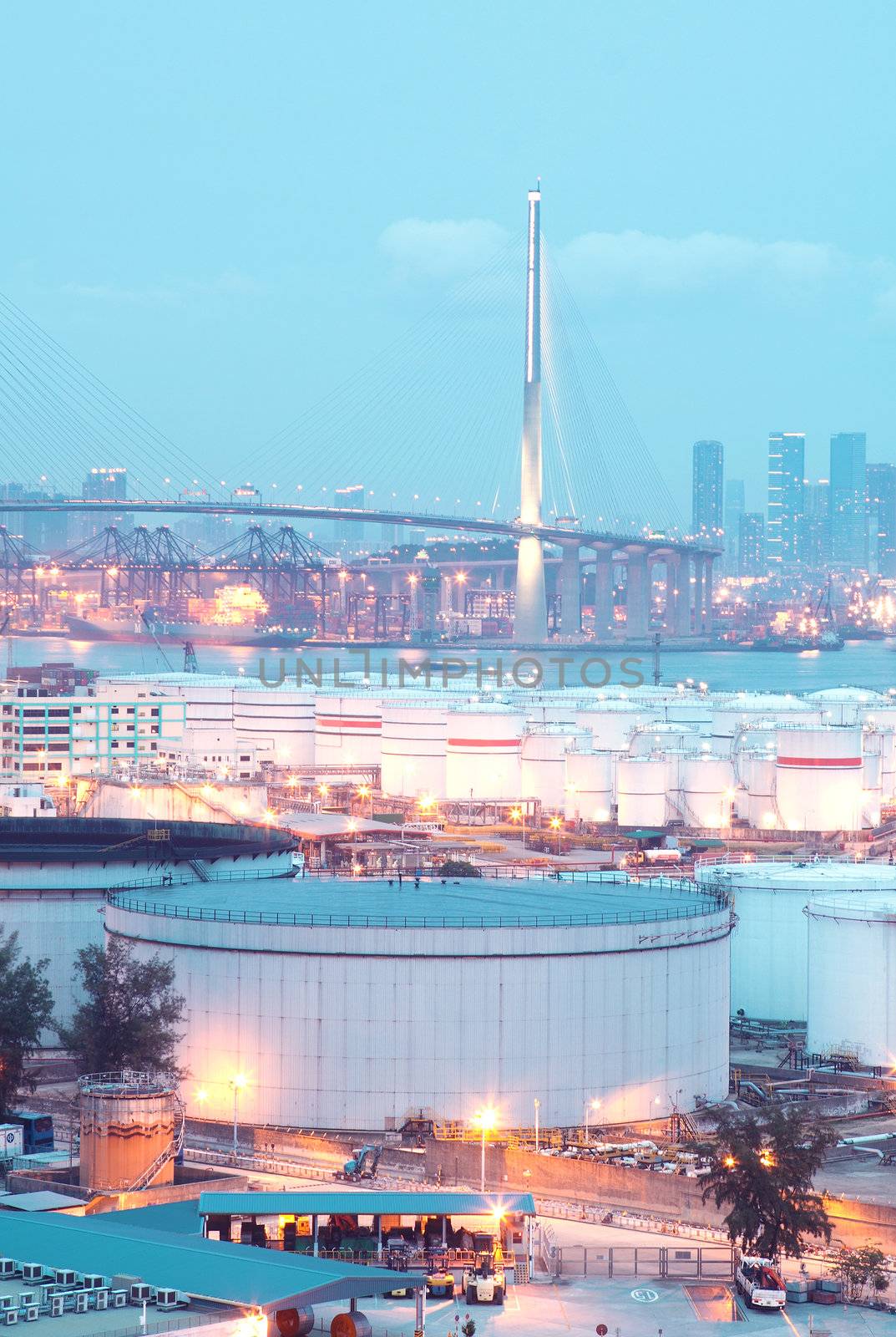 gas container and bridge at night,hong kong