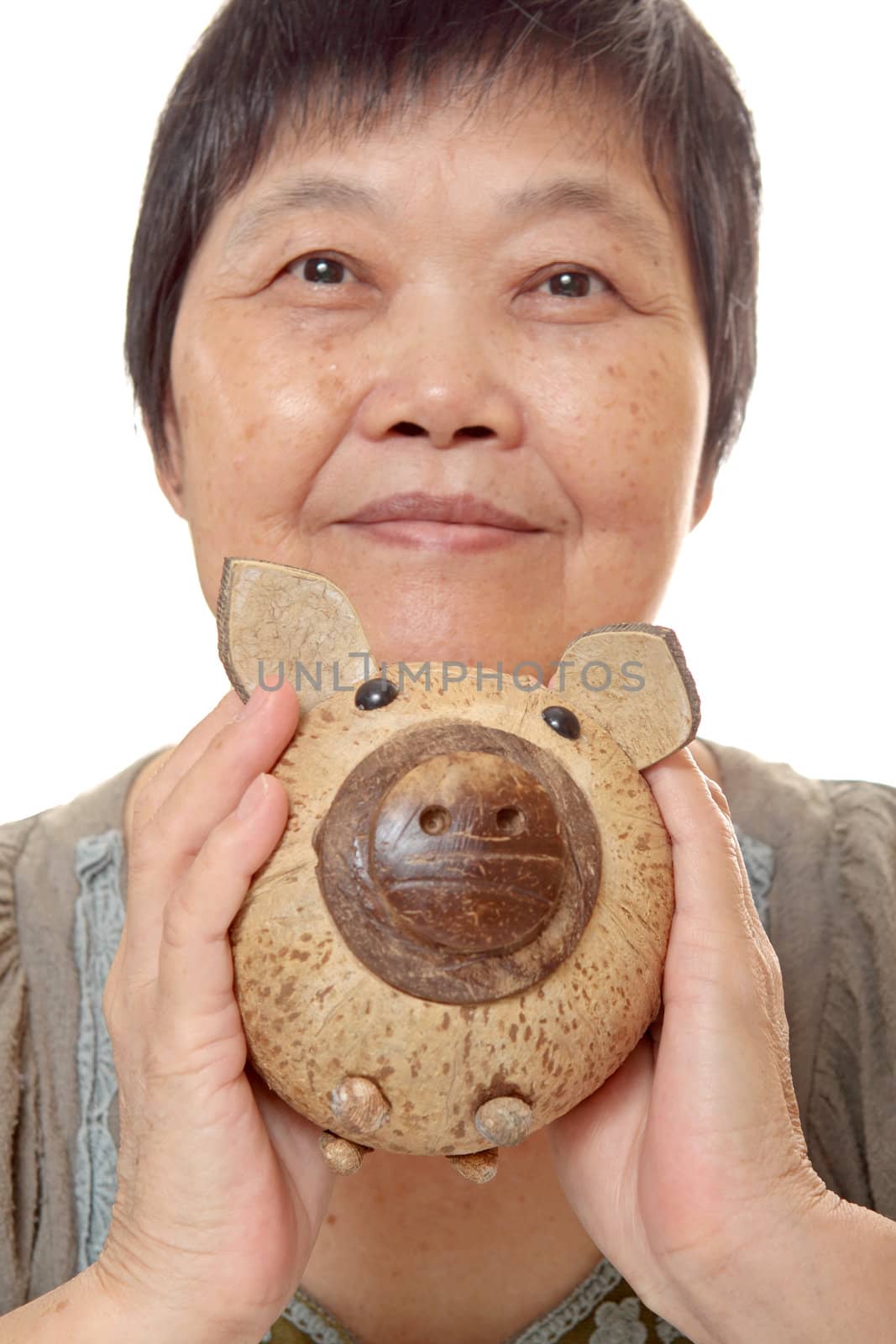 woman putting coins in small piggy bank. Selective focus, Copy space 