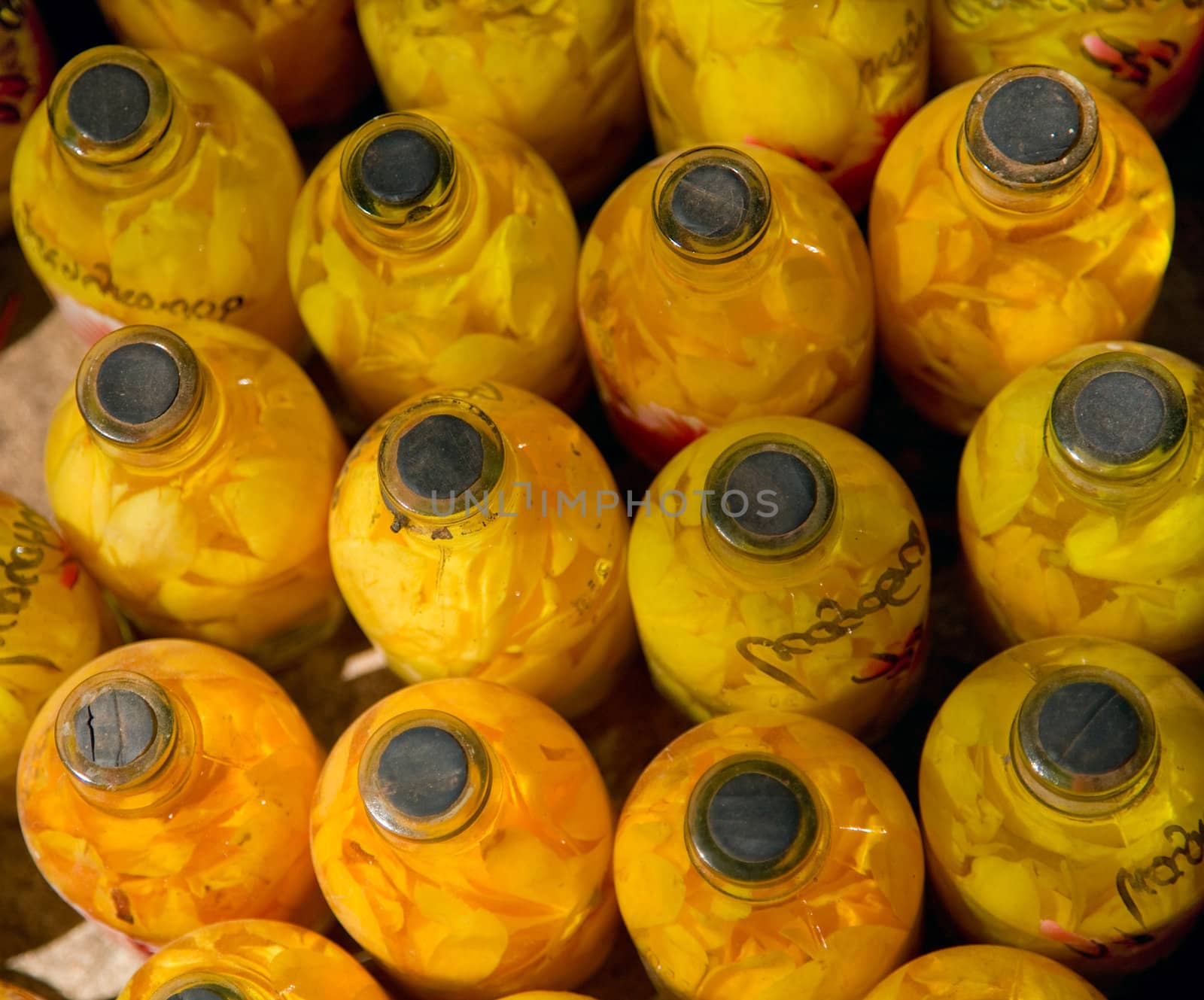 bud of yellow flowers  in transparent glass bottles