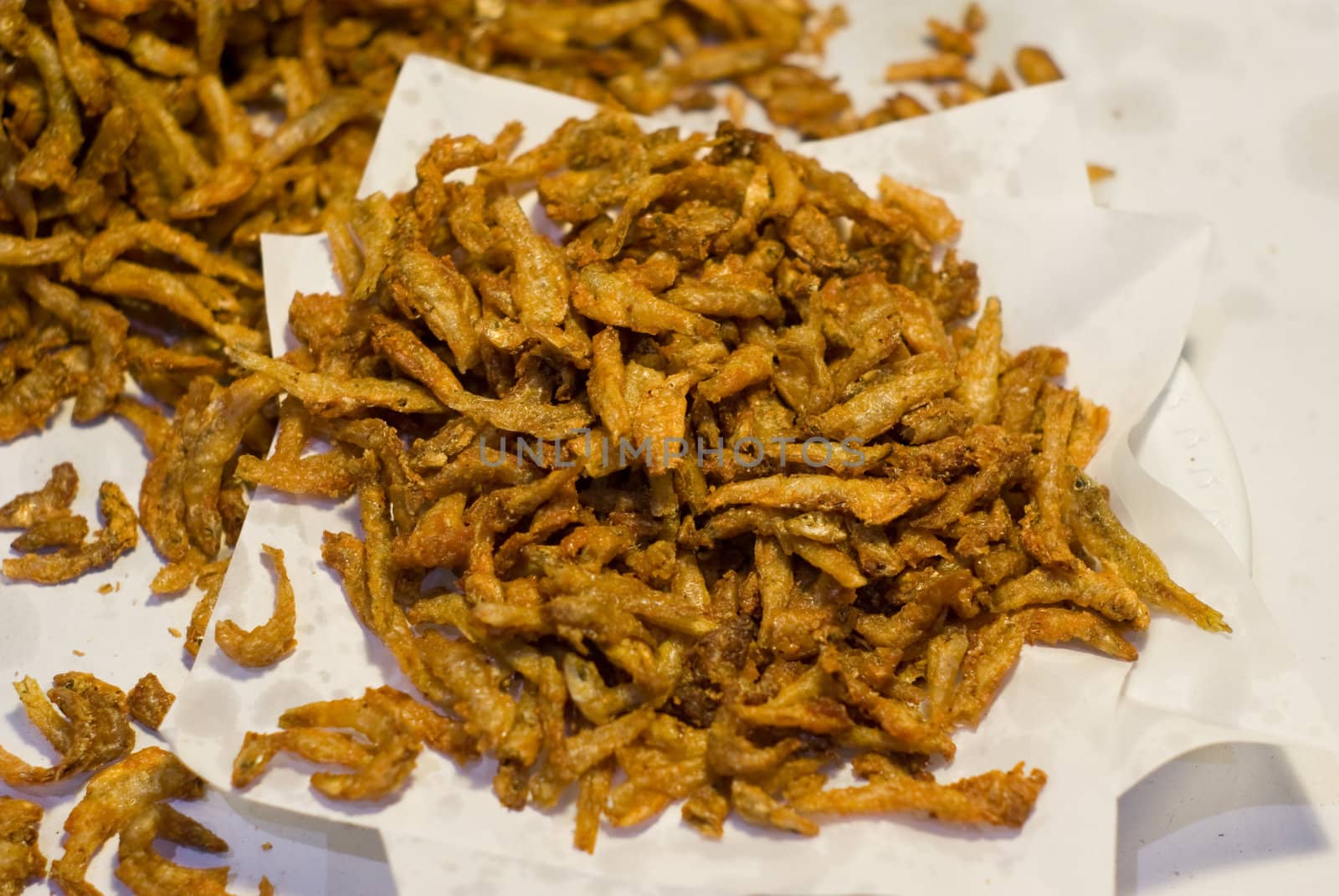 Fried fish on the paper in the market, Thai food