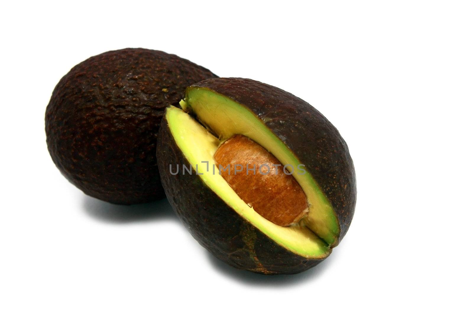 two fresh avocados isolated on white background