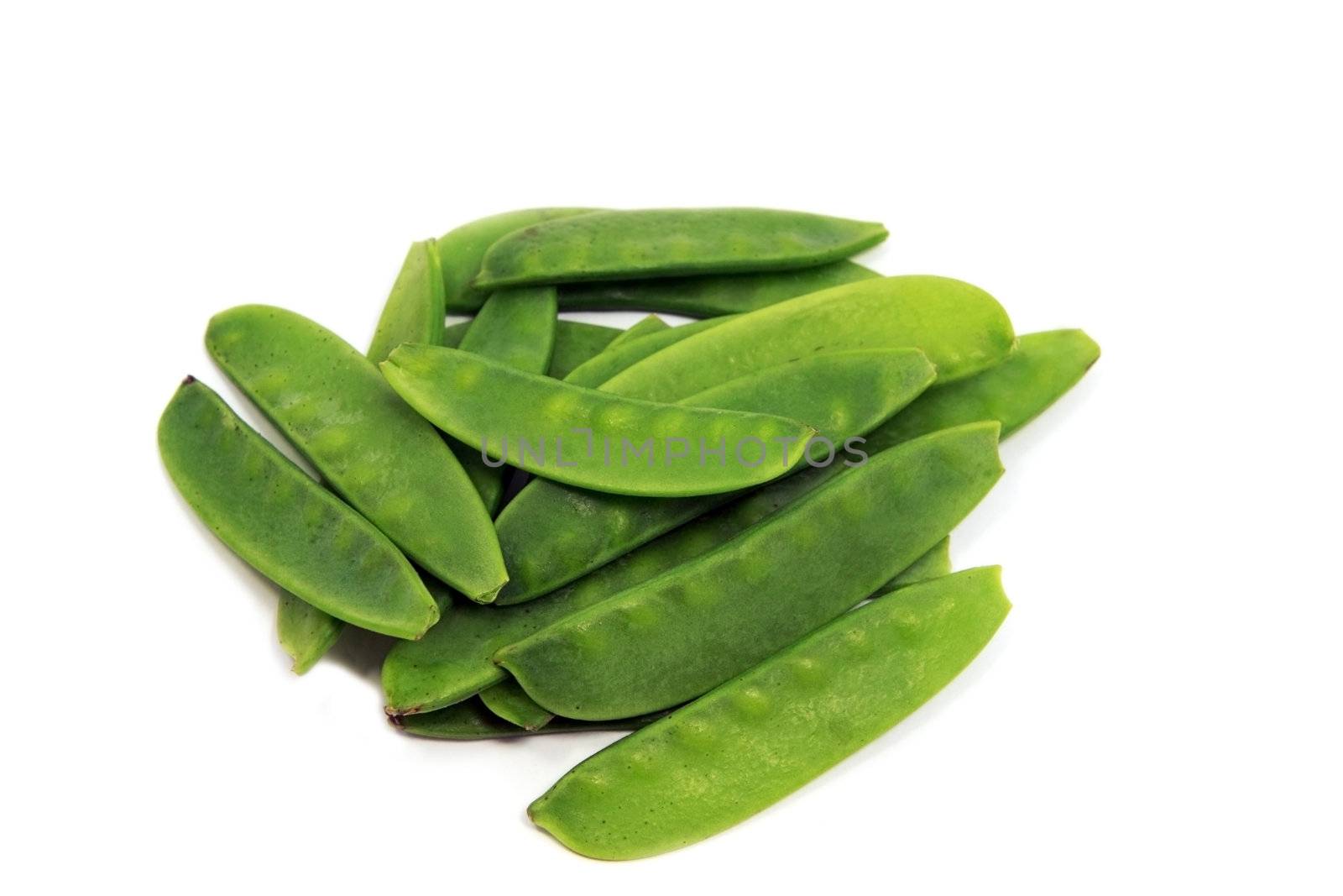 many green pea pods on white background