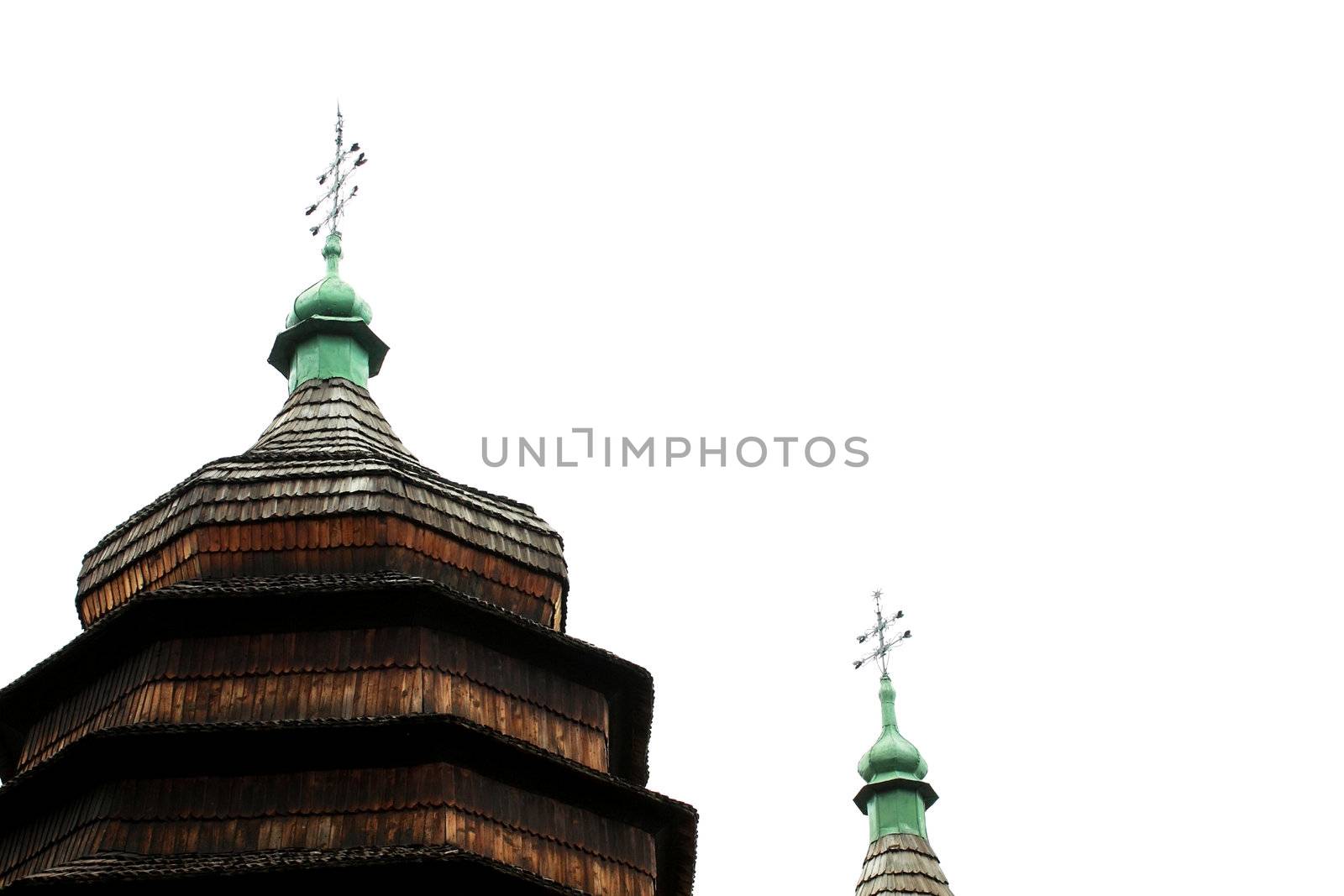 fragment of old wooden church over sky