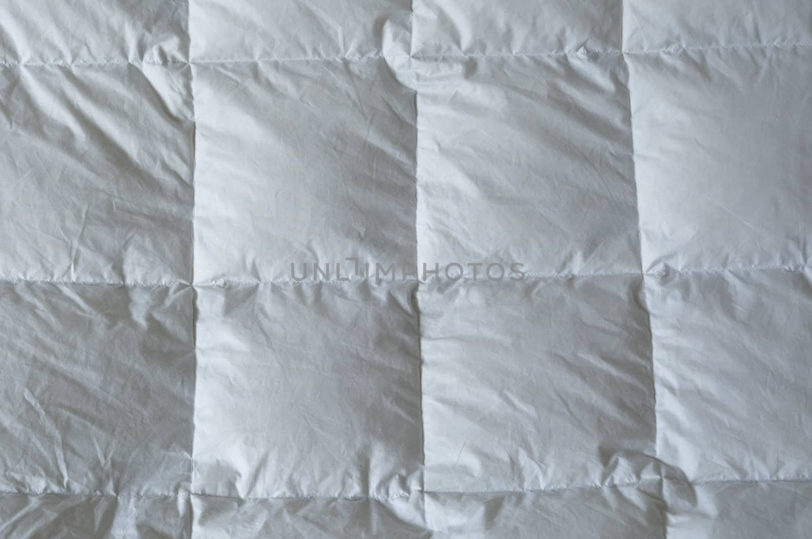 Detail of down comforter with white squares