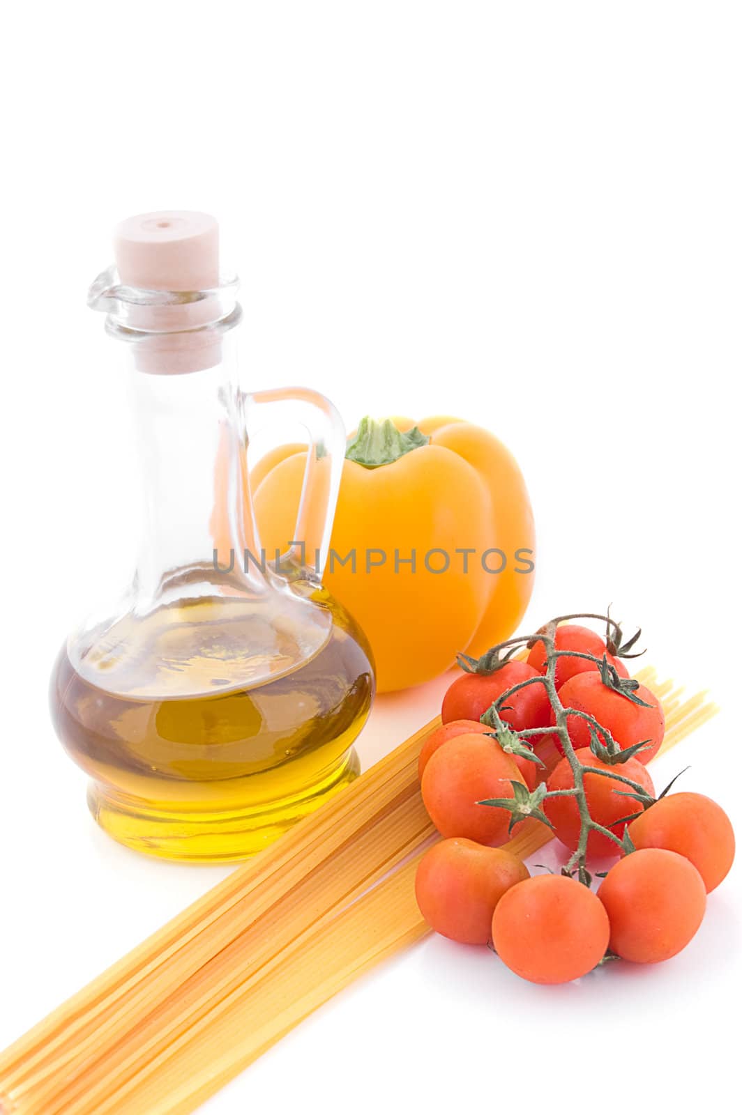 Olive oil, pasta and cherry tomatoes over white