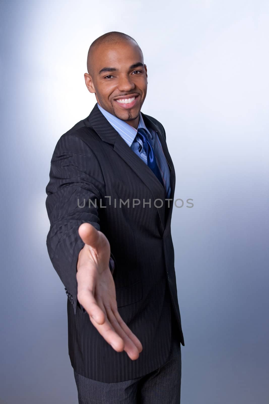 Smiling businessman giving hand by anikasalsera