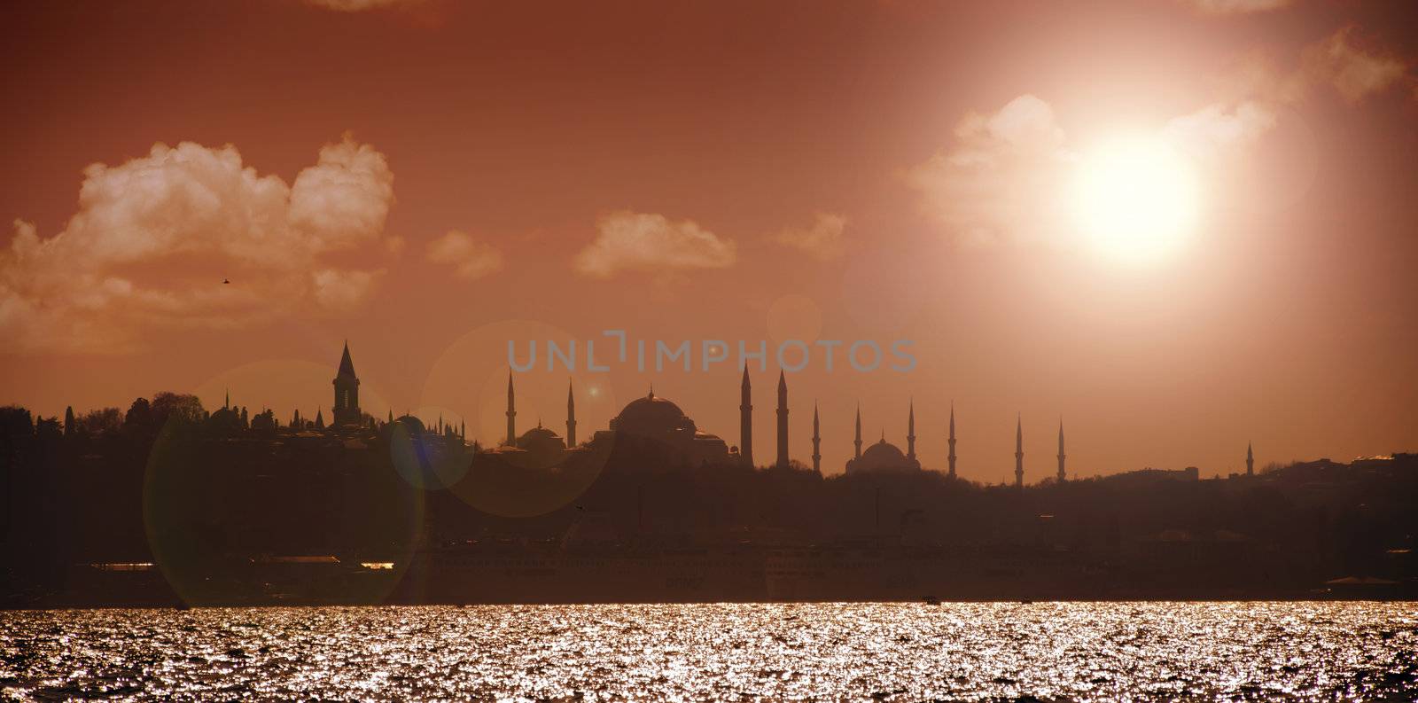 A sunset image of beautiful Istanbul silhouette with Ayasofya, Blue Mosque and Topkapi Palace