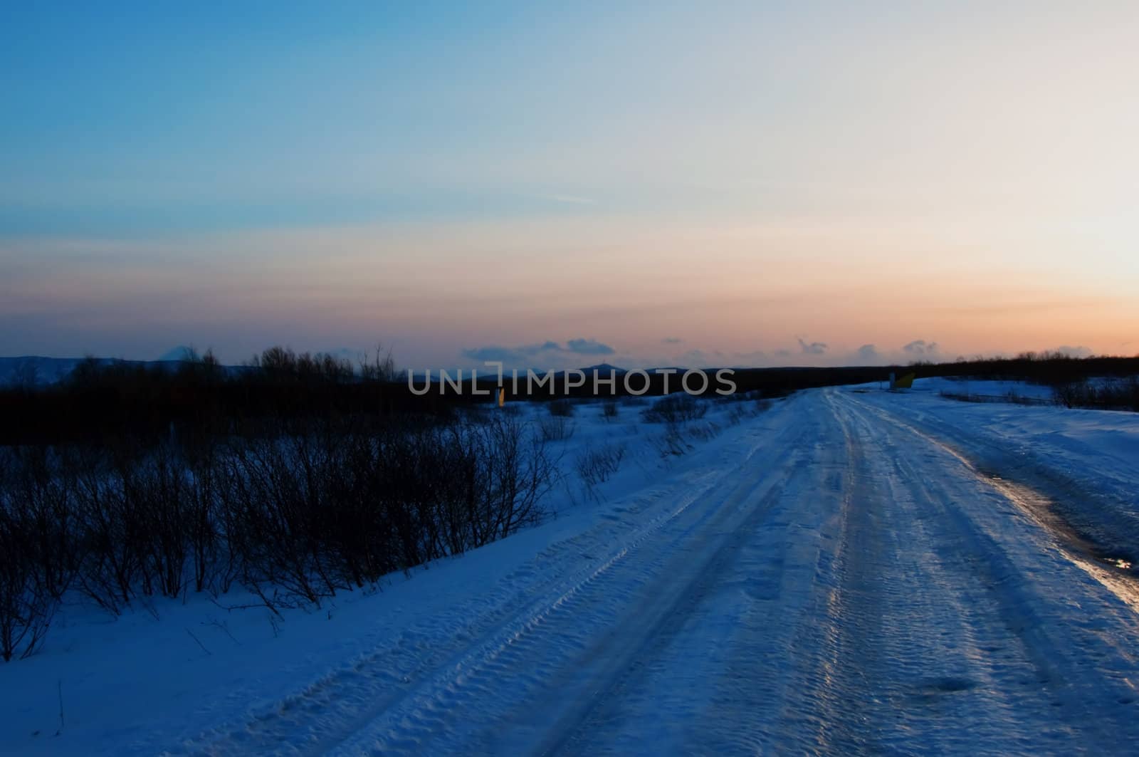 Winter road on a decline in Russia