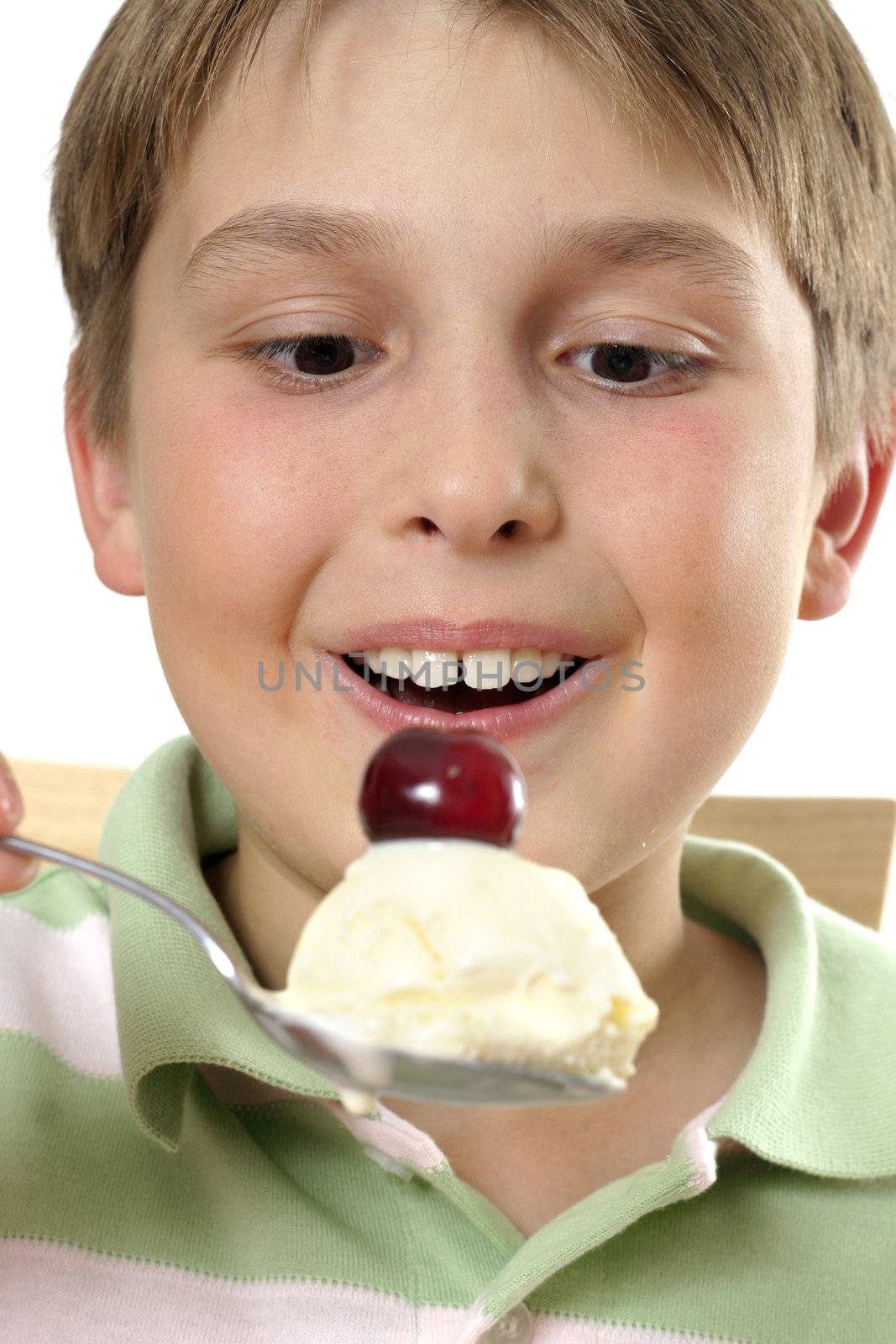 Smiling boy holding large scoop of ice cream by lovleah