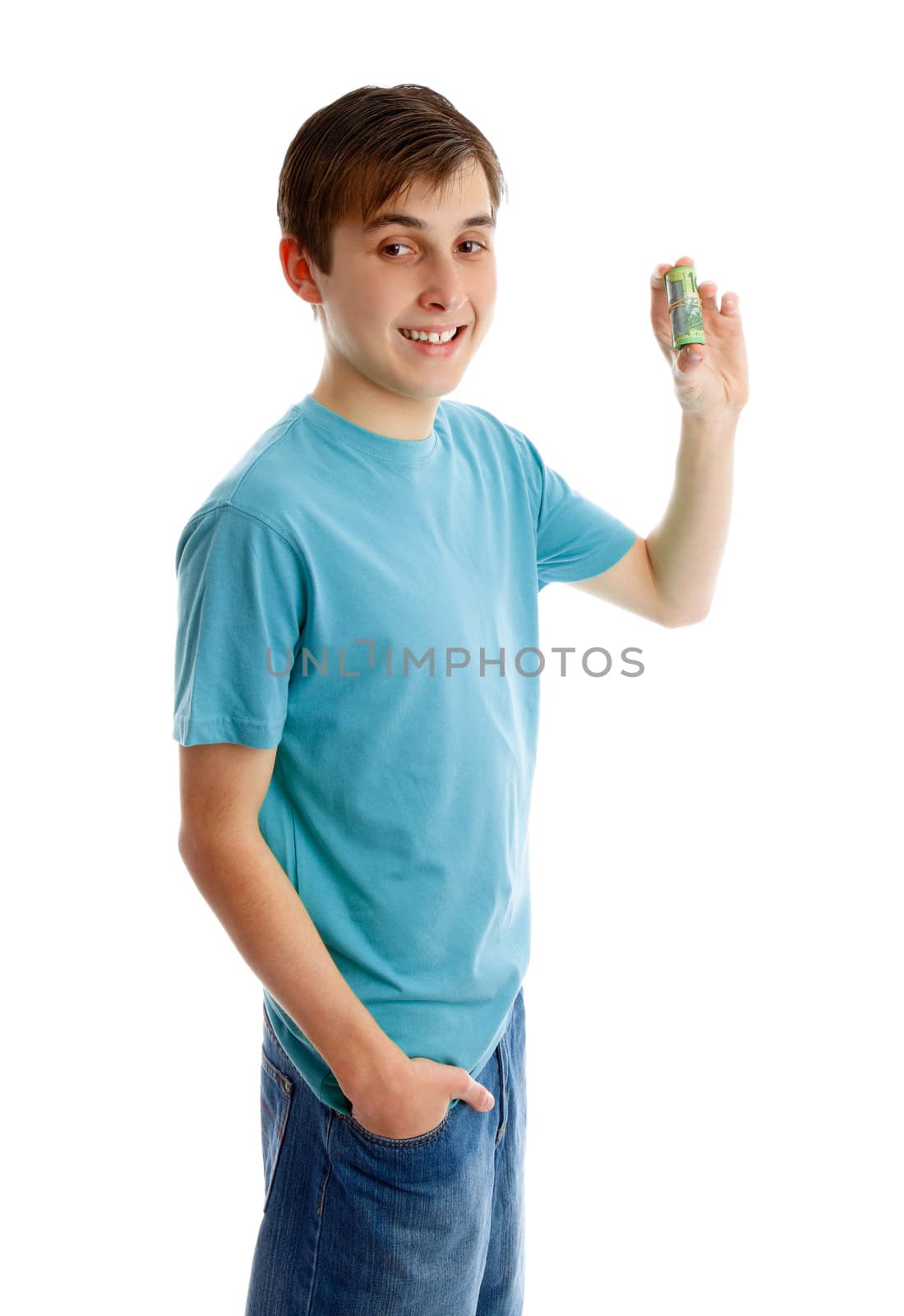 Happy boy holding rolled up bank notes.