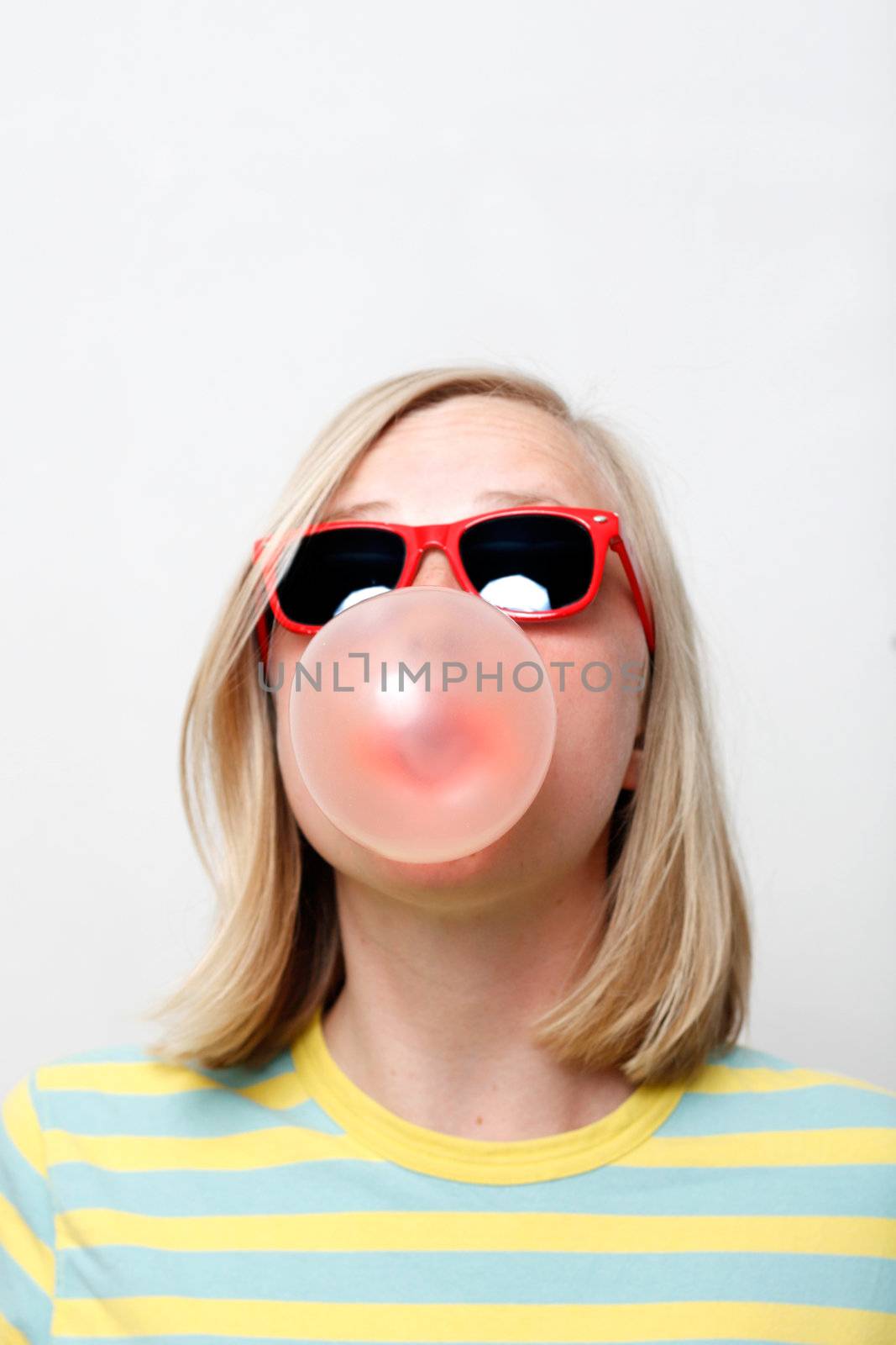 A girl playing with her chewing gum