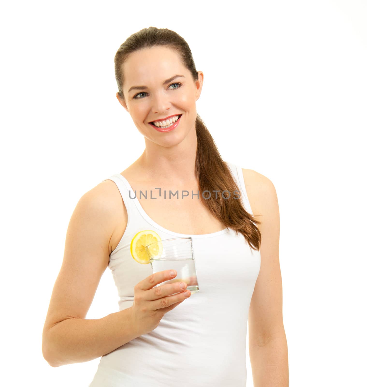 Isolated portrait of a young beautiful fresh woman holding a glass of water with slice of lemon.