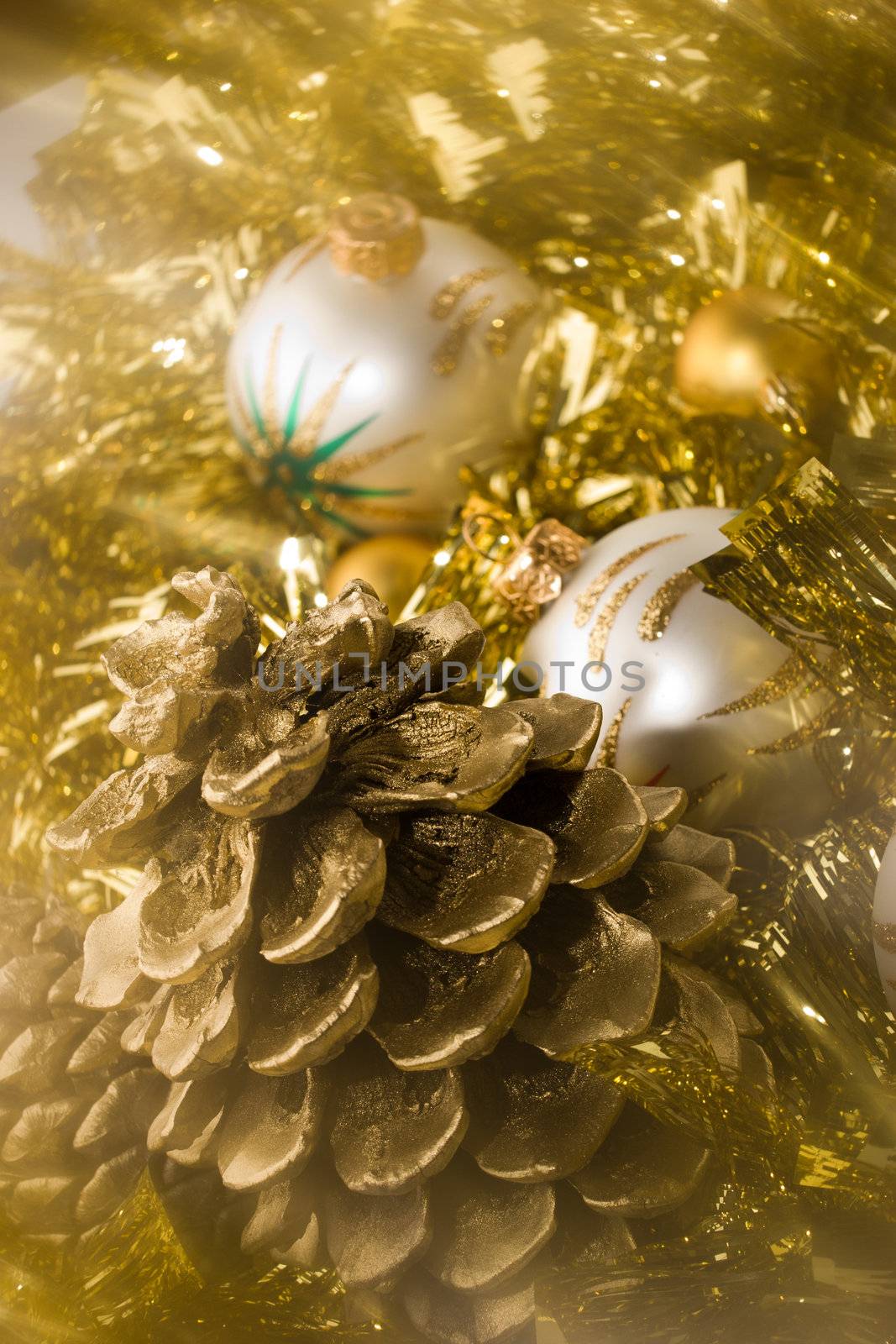 white Christmas ball, golden cone and garland, shoot with soft filter