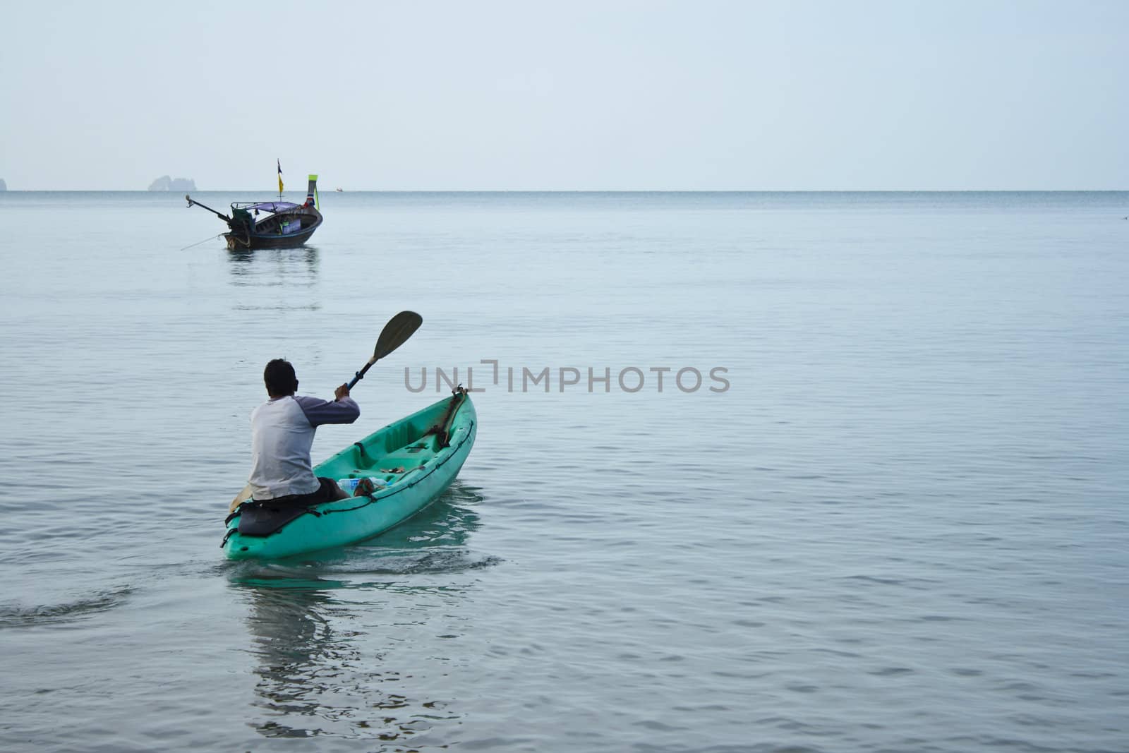 Man in a kayak on the ocean