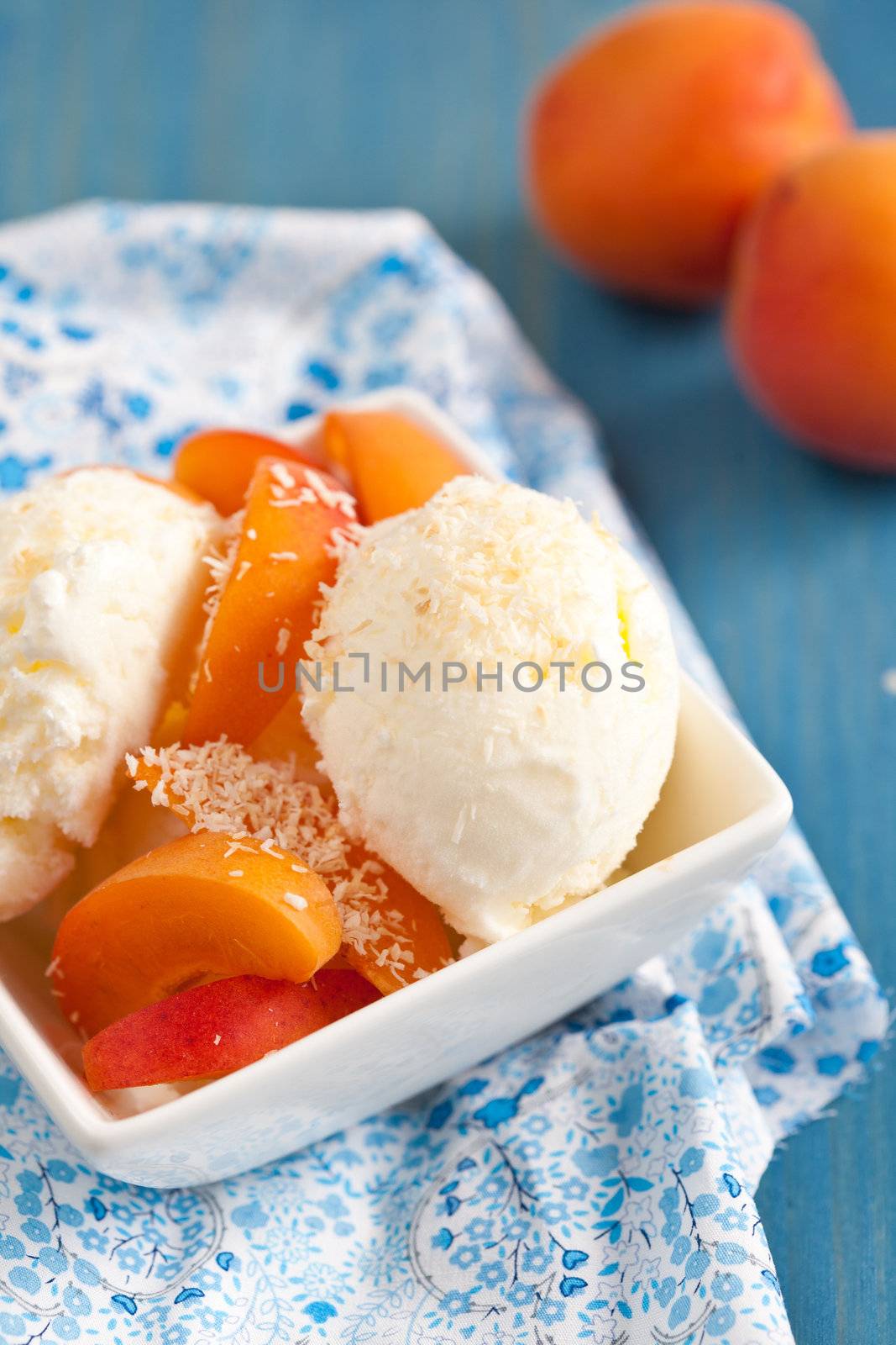 Fresh dessert with coconut, peaces and icecream