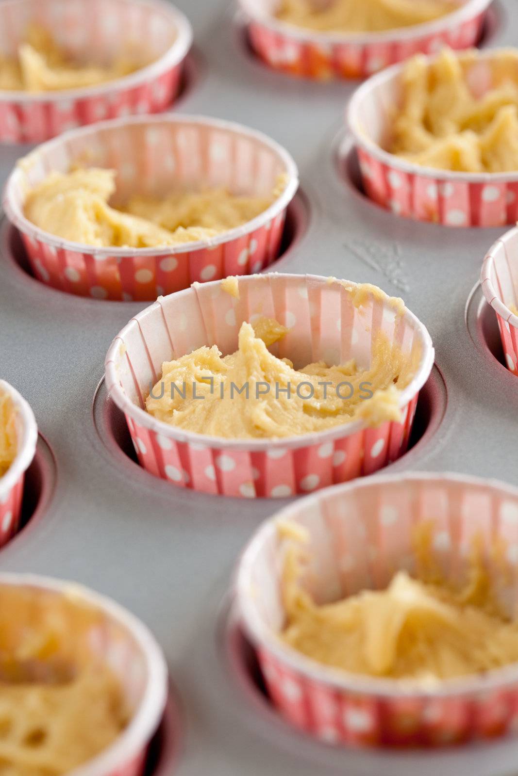Dough in cupcake tins by Fotosmurf