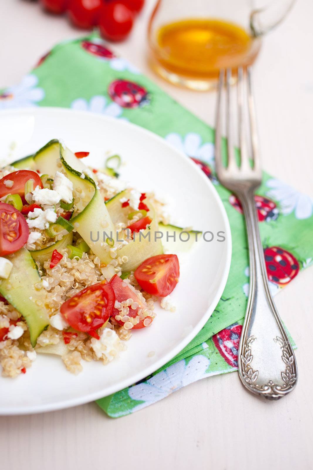 Refreshing and healthy quinoa salad with zucchini and tomatoes