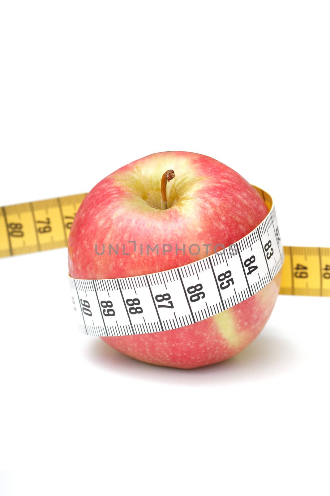 An apple measured with tape measure