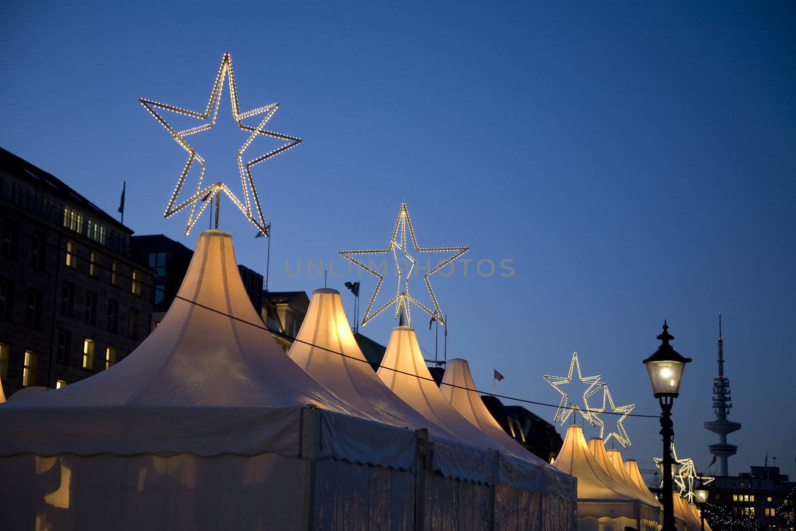 Top of tents with stars - Christmas Market, Hamburg - Germany. Space for text.