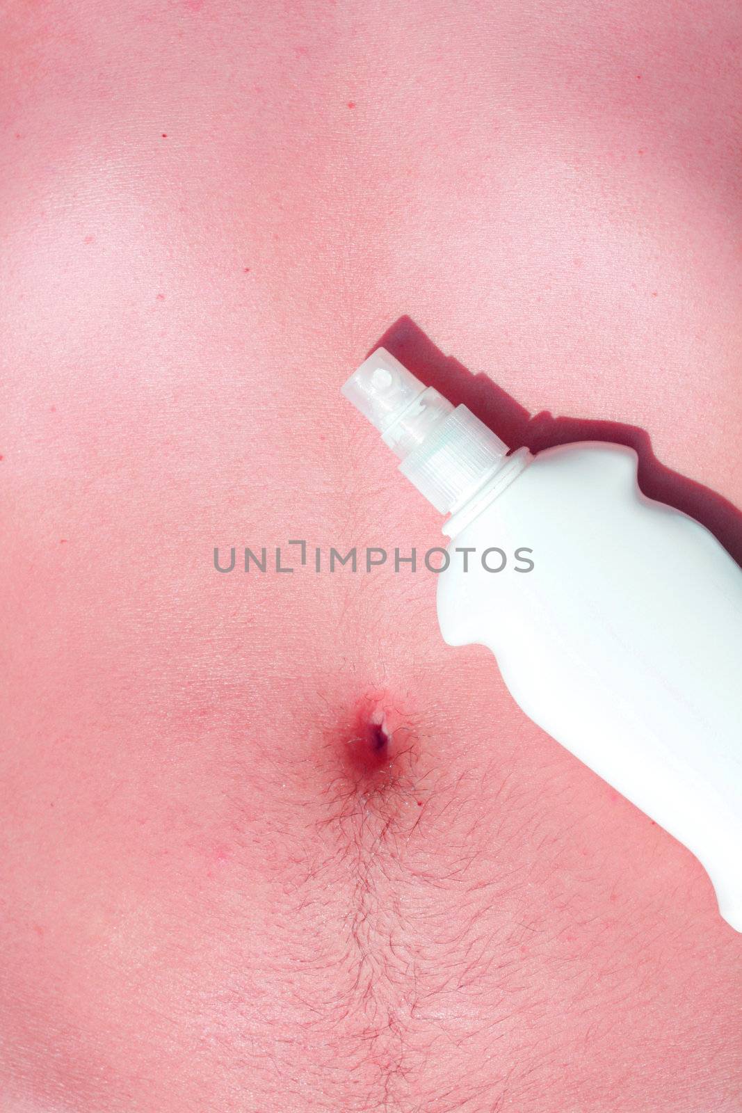 Sunscreen and a male body
